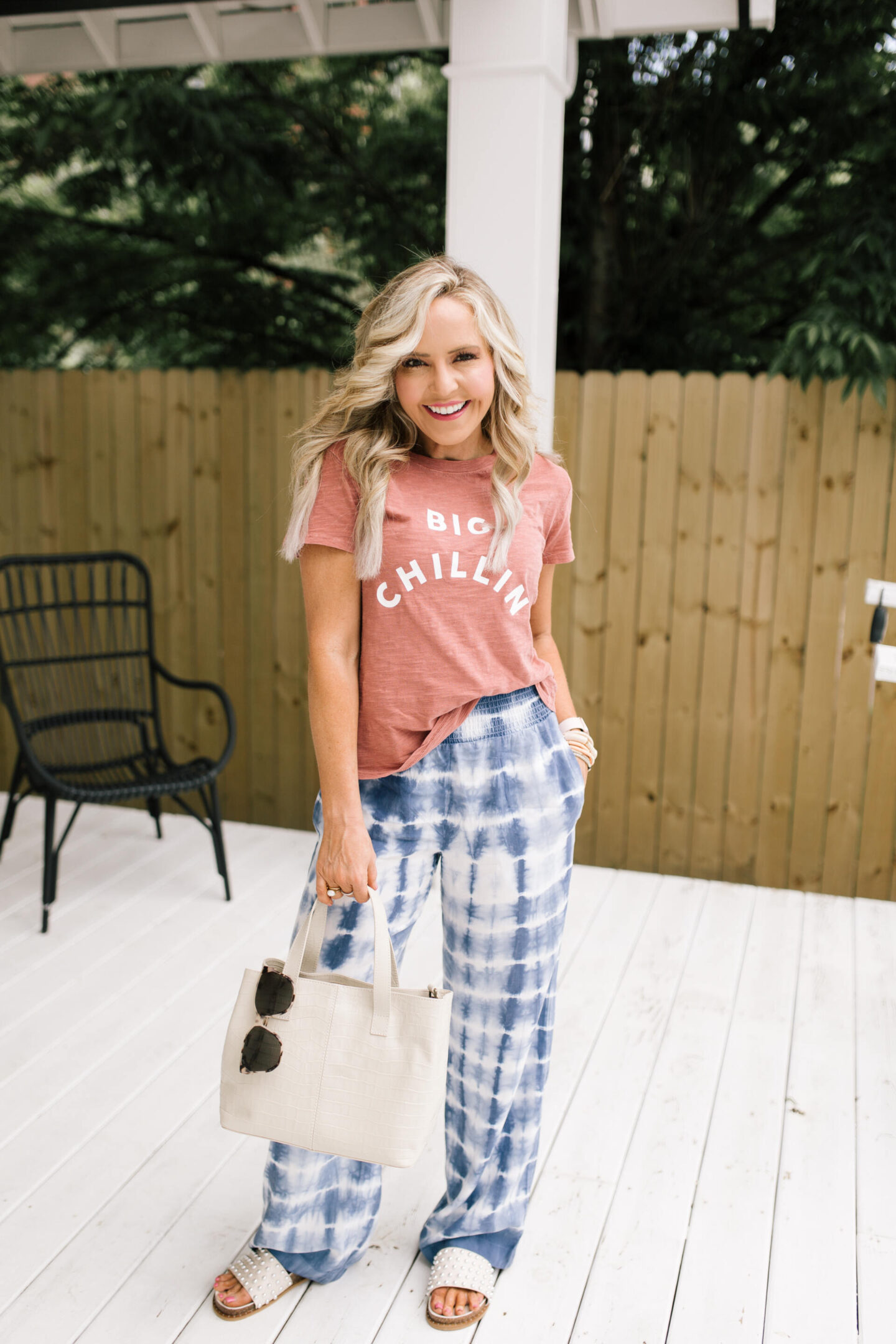 4th of July Deals by popular Nashville life and style blog, Hello Happiness: image of Natasha Stoneking wearing a Evereve Big Chillin tee and tie dye wide leg pants.