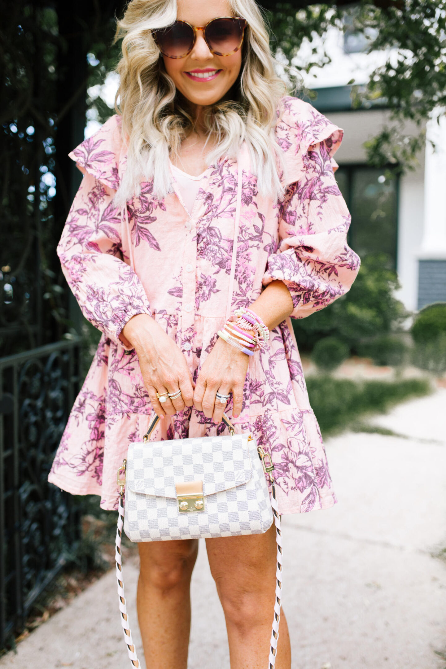 Summer Dress by popular Nashville fashion blog, Hello Happiness: image of a woman standing under a pergola and wearing a sunbaked swing dress, platform espadrilles, and holding a Croisette crossbody. 