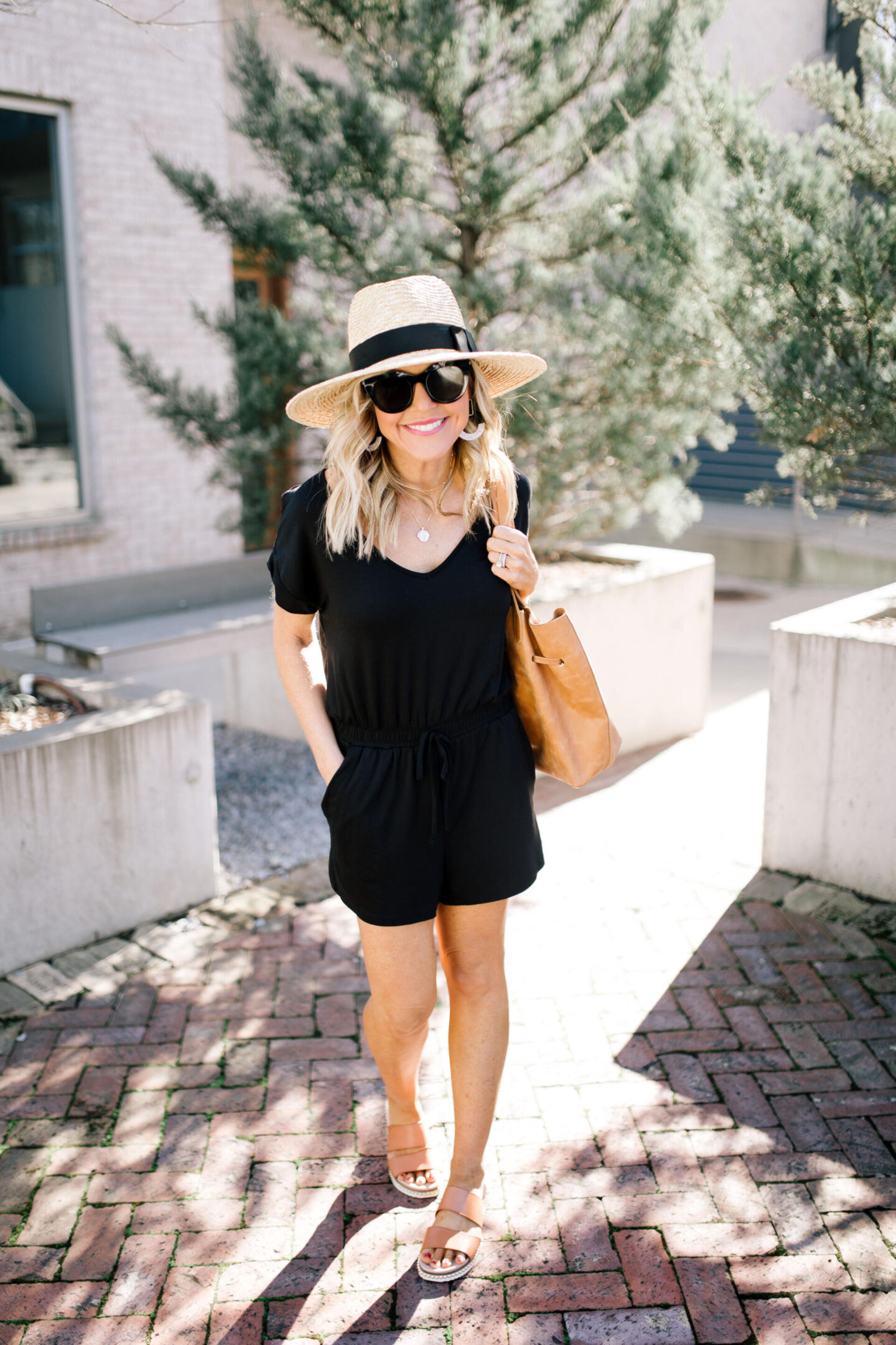 Shopbop Spring Sale by popular Nashville fashion blog, Hello Happiness: image of a woman standing outside and wearing a Shopbop Blaire Jersey Romper.  