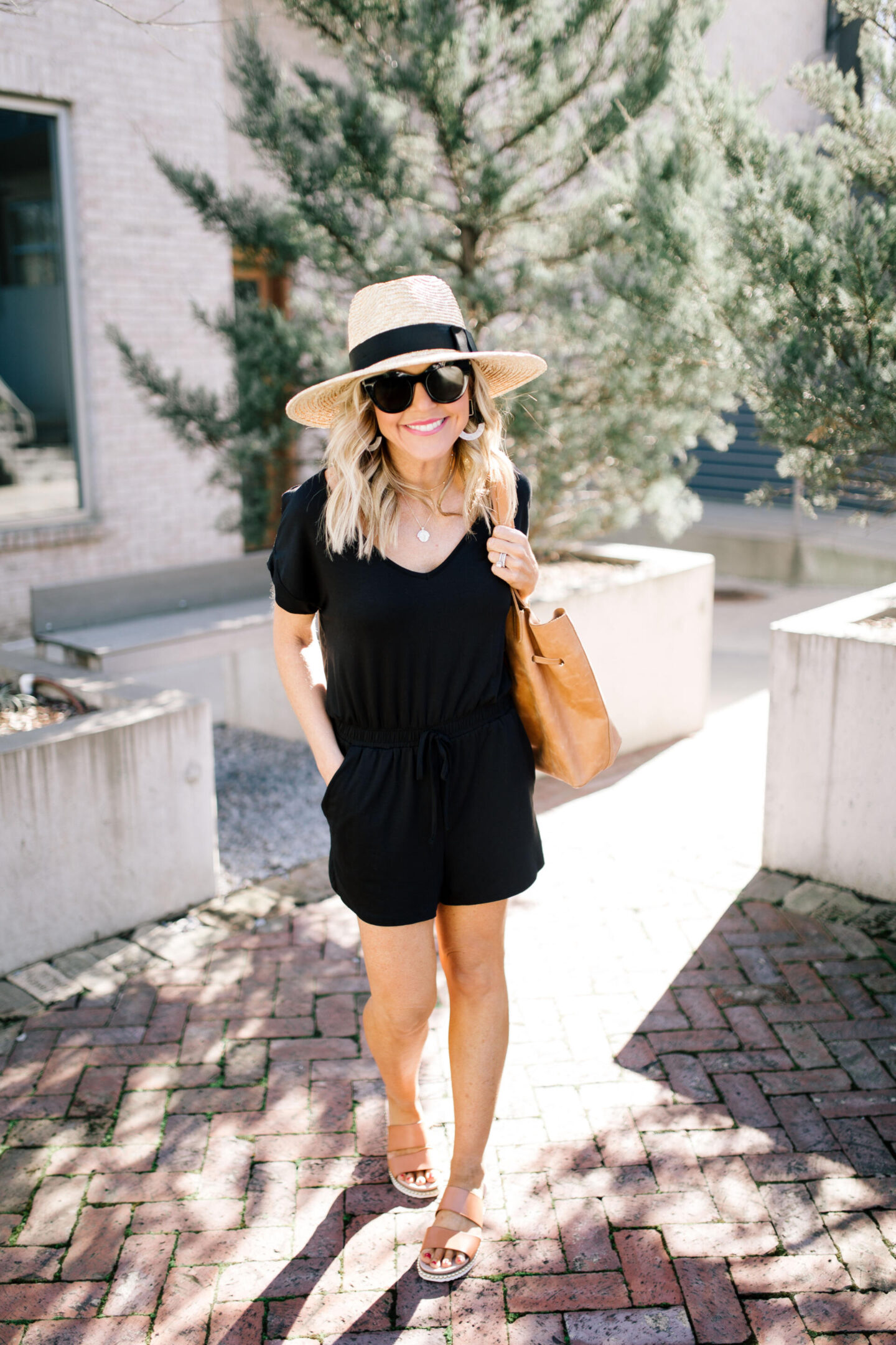 Shopbop Spring Sale by popular Nashville fashion blog, Hello Happiness: image of a woman standing outside and wearing a Shopbop Blaire Jersey Romper.