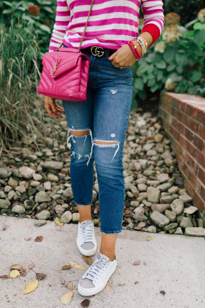 Hi Sugarplum by popular Nashville fashion blog, Hello Happiness: image of Natasha Stoneking wearing a Gibsonlook Camden Gathered Sleeve Crewneck Pullover, Abercrombie and Fitch Ultra High Rise Ankle Straight Jeans,YVES SAINT LAURENT Calfskin Y Quilted Monogram Small Loulou Chain Satchel Fresh Fuchsia, and P448 sneakers.