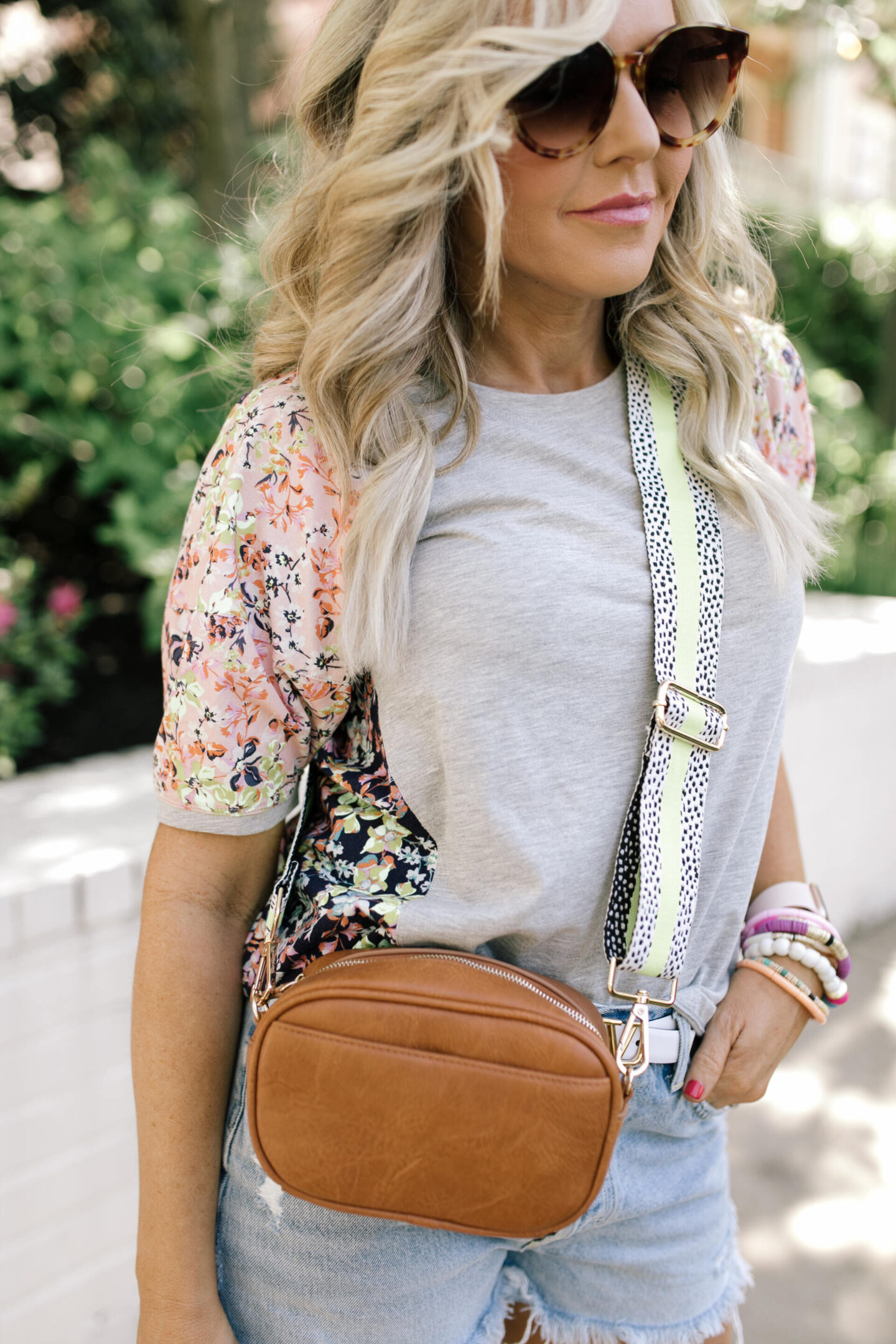 Bag Straps by popular Nashville fashion blog, Hello Happiness:image of Natasha Stoneking carrying a bag with a Social Threads bag strap. 
