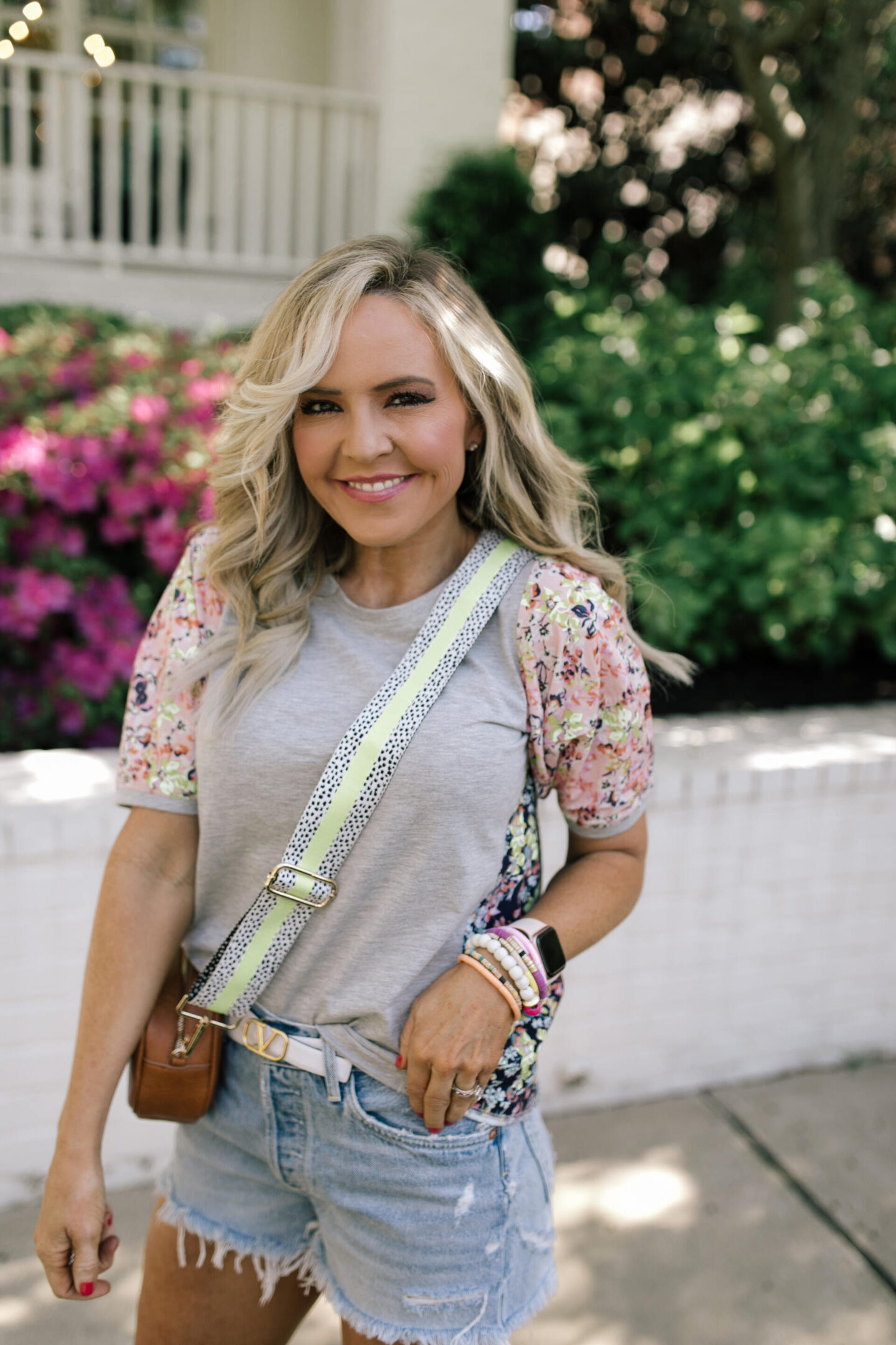 Bag Straps by popular Nashville fashion blog, Hello Happiness:image of Natasha Stoneking carrying a bag with a Social Threads bag strap. 