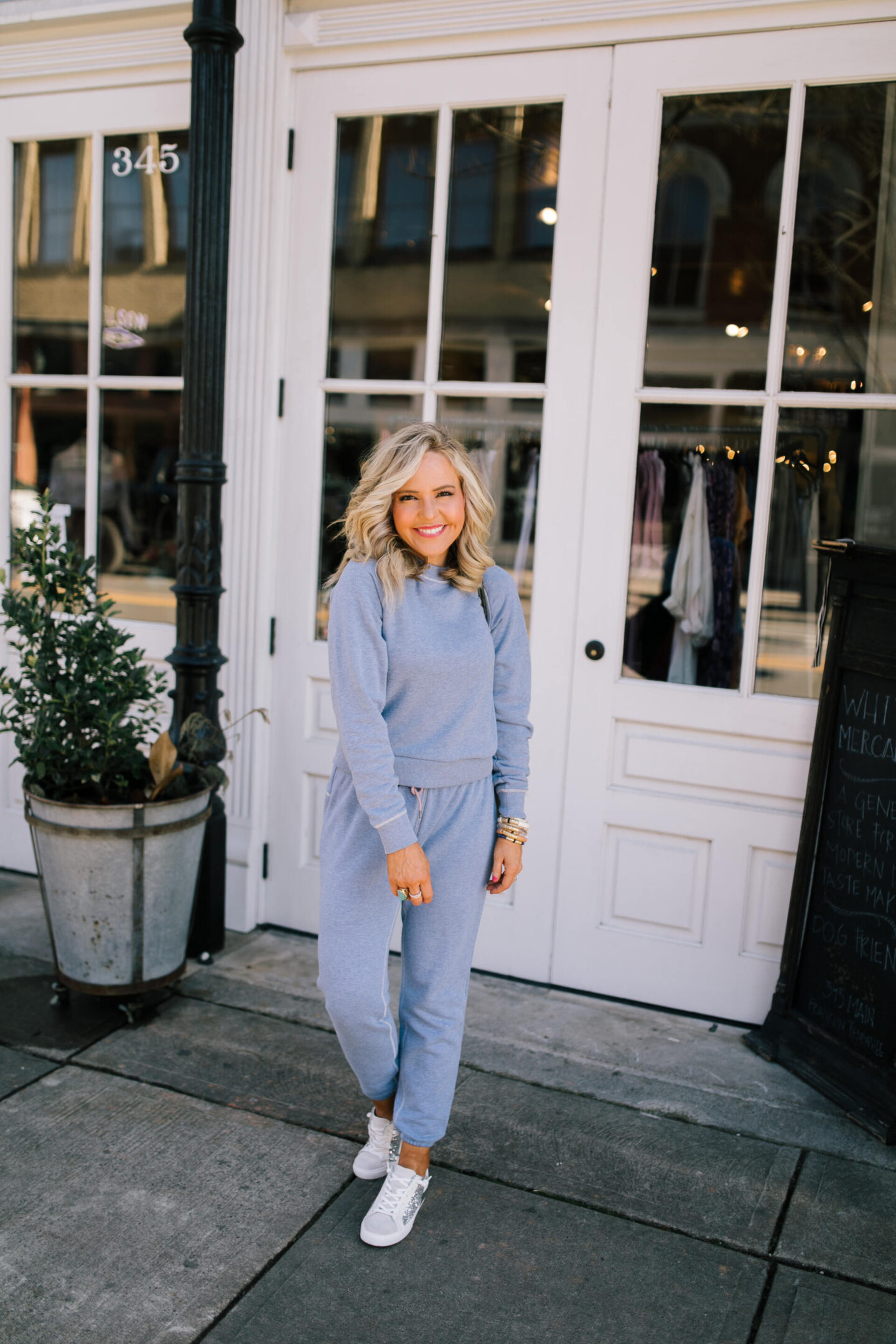 Walmart Free Assembly by popular Nashville fashion blog, Hello Happiness: image of Natasha Stoneking wearing a Walmart Free Assembly classic raglan sweatshirt and sweatpants.