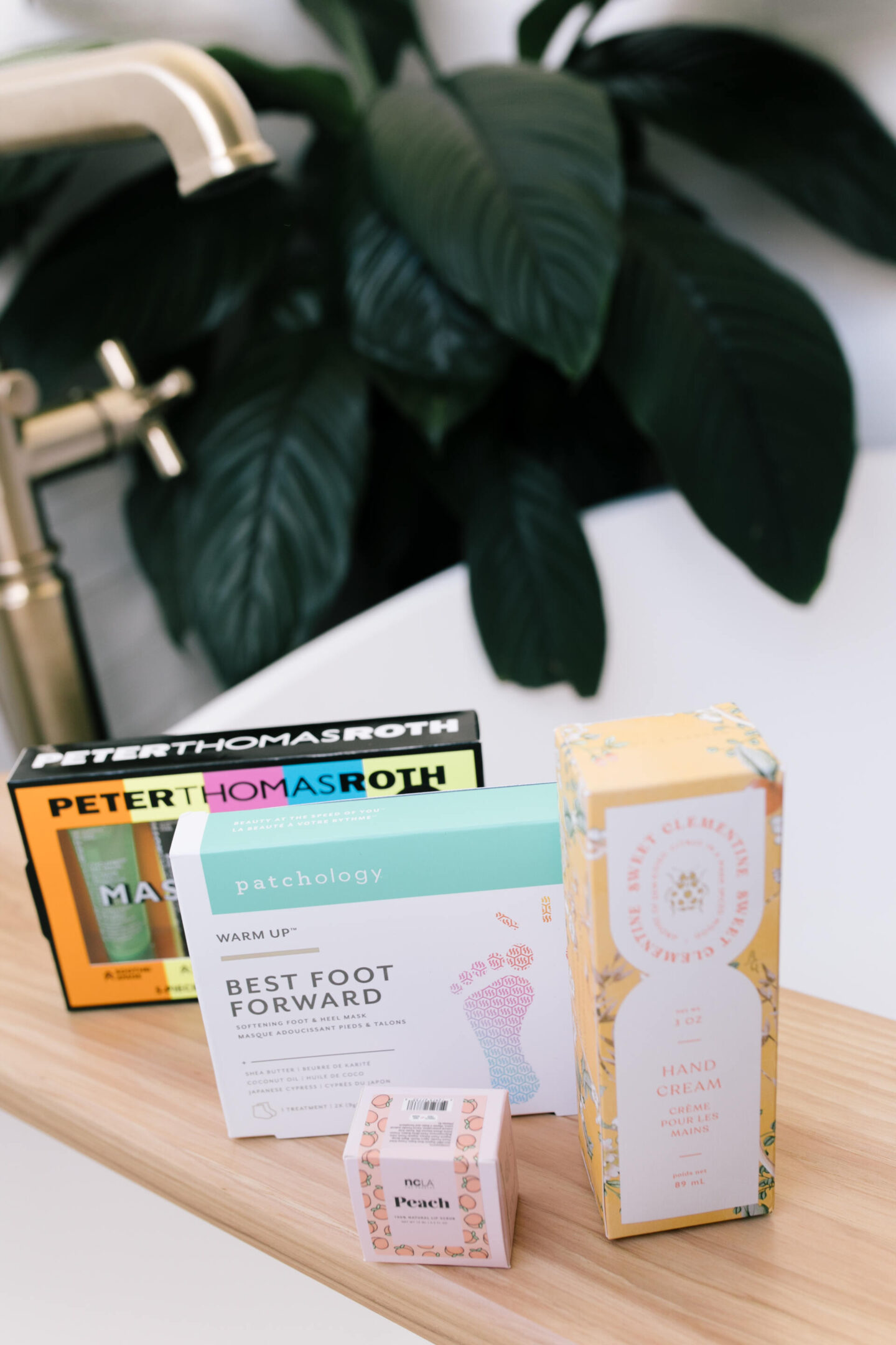 Anthropologie Sale by popular Nashville life and style blog, Hello Happiness: image of Peter Thomas Roth mask set, Patcholog Best Foot Forward, NCLA peach balm, and hand cream. 