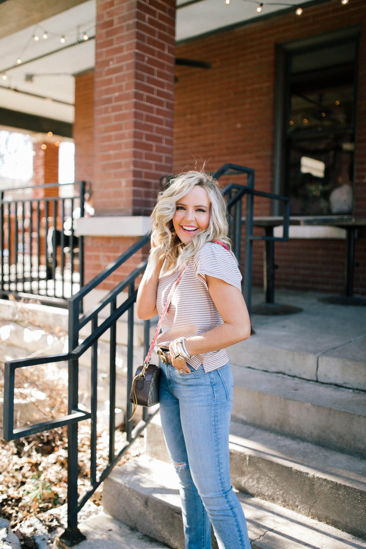 Walmart Free Assembly by popular Nashville fashion blog, Hello Happiness: image of Natasha Stoneking wearing a Walmart Free Assembly The Striped flutter sleeve tee and high rise skinny jeans.