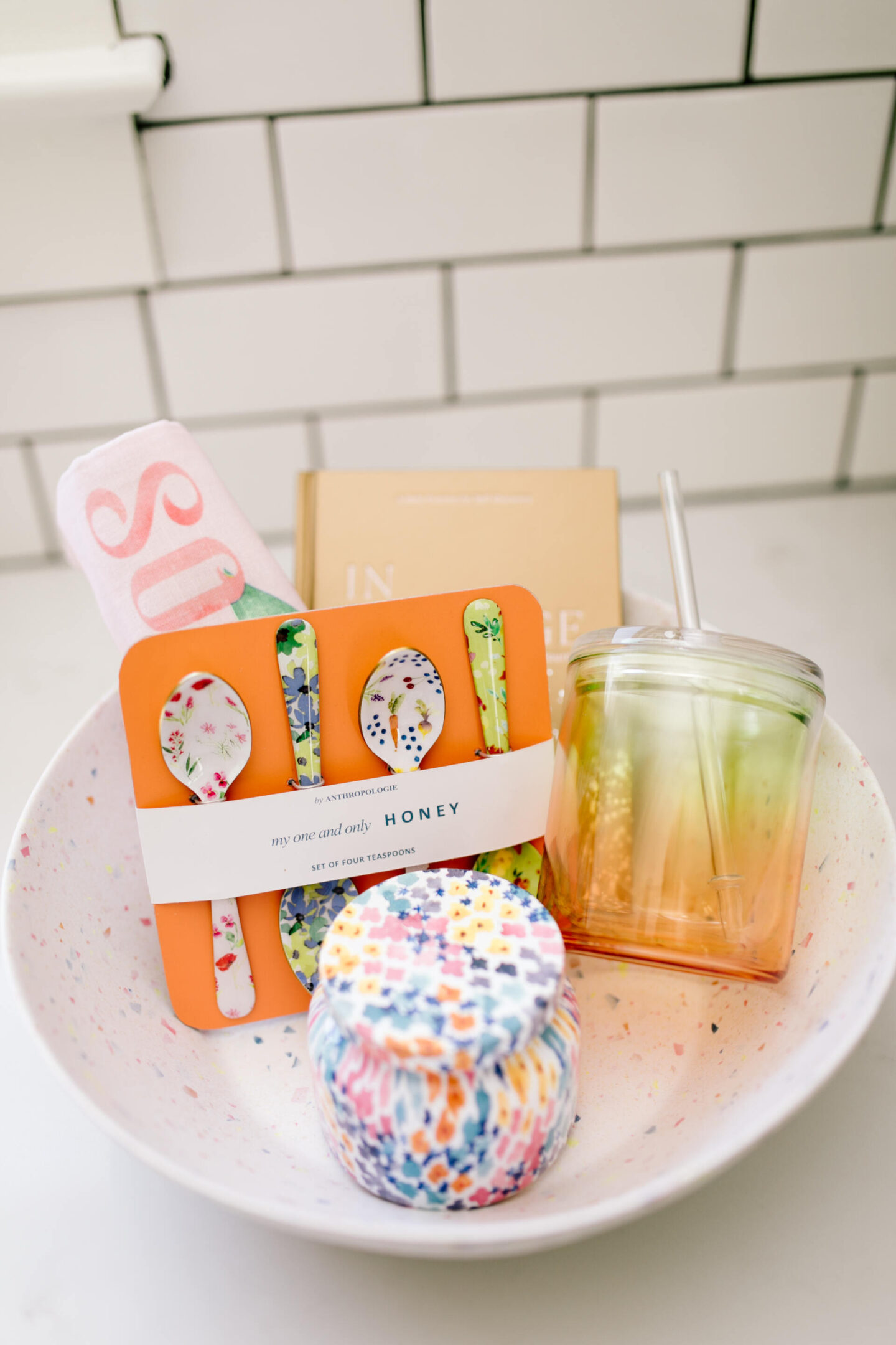 Mother's Day Gift Guide by popular Nashville life and style blog, Hello Happiness: image of a candle, Anthropologie spoons, and a mason jar tumbler in a bowl.