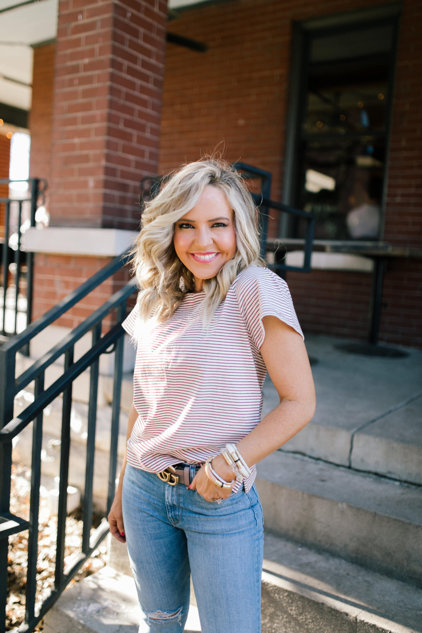 Walmart Free Assembly by popular Nashville fashion blog, Hello Happiness: image of Natasha Stoneking wearing a Walmart Free Assembly The Striped flutter sleeve tee and high rise skinny jeans.