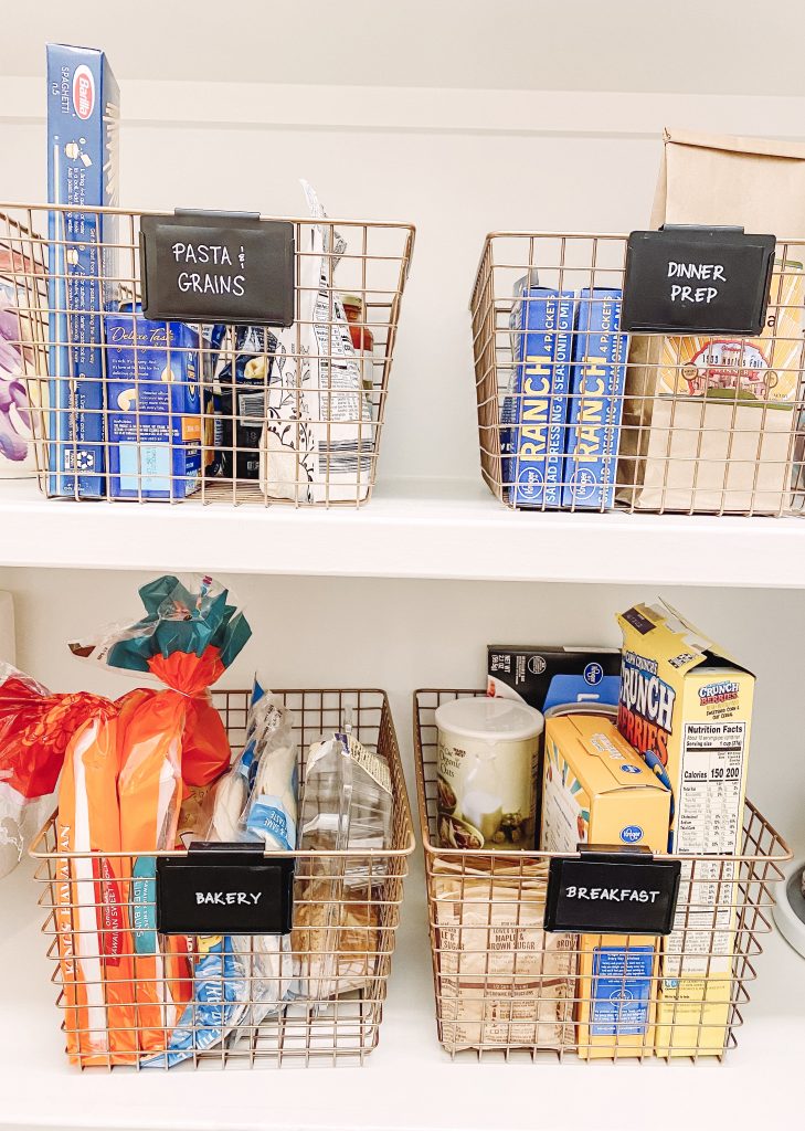 Kitchen Pantry Organization by popular Nashville life and style blog, Hello Happiness: image of a pantry organized with baskets from The Container Store.