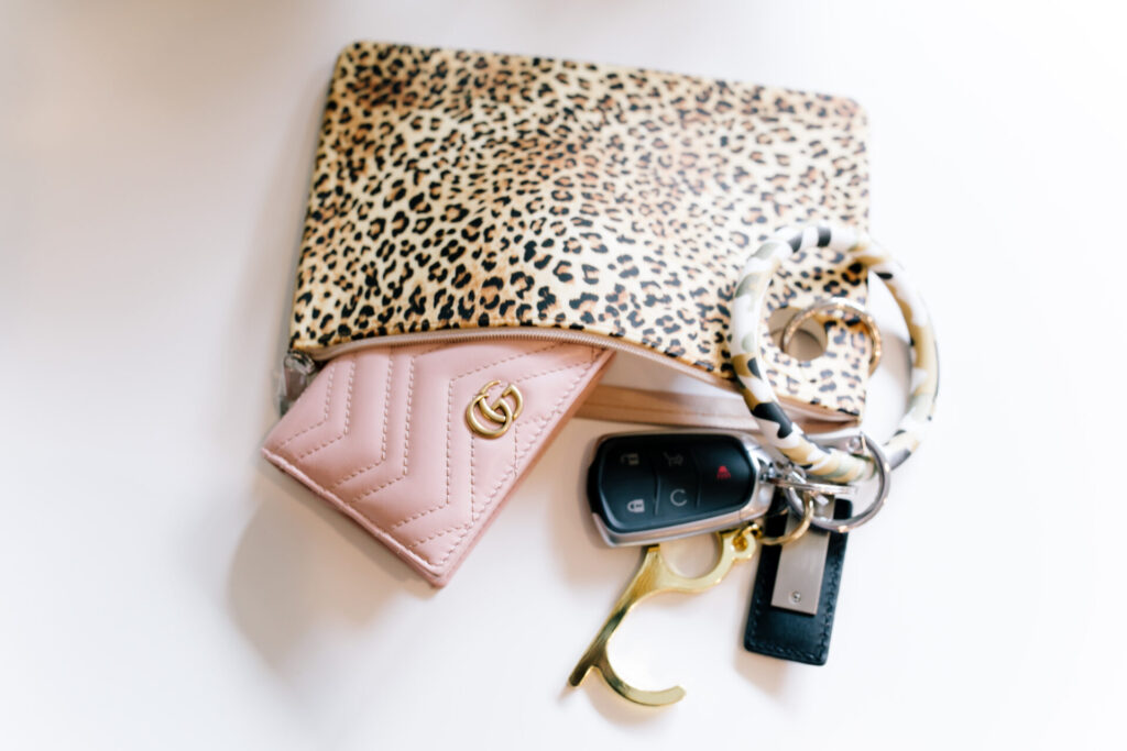 Cyber Monday Sale by popular Nashville life and style blog, Hello Happiness: image of a leopard print clutch and Gucci wallet. 