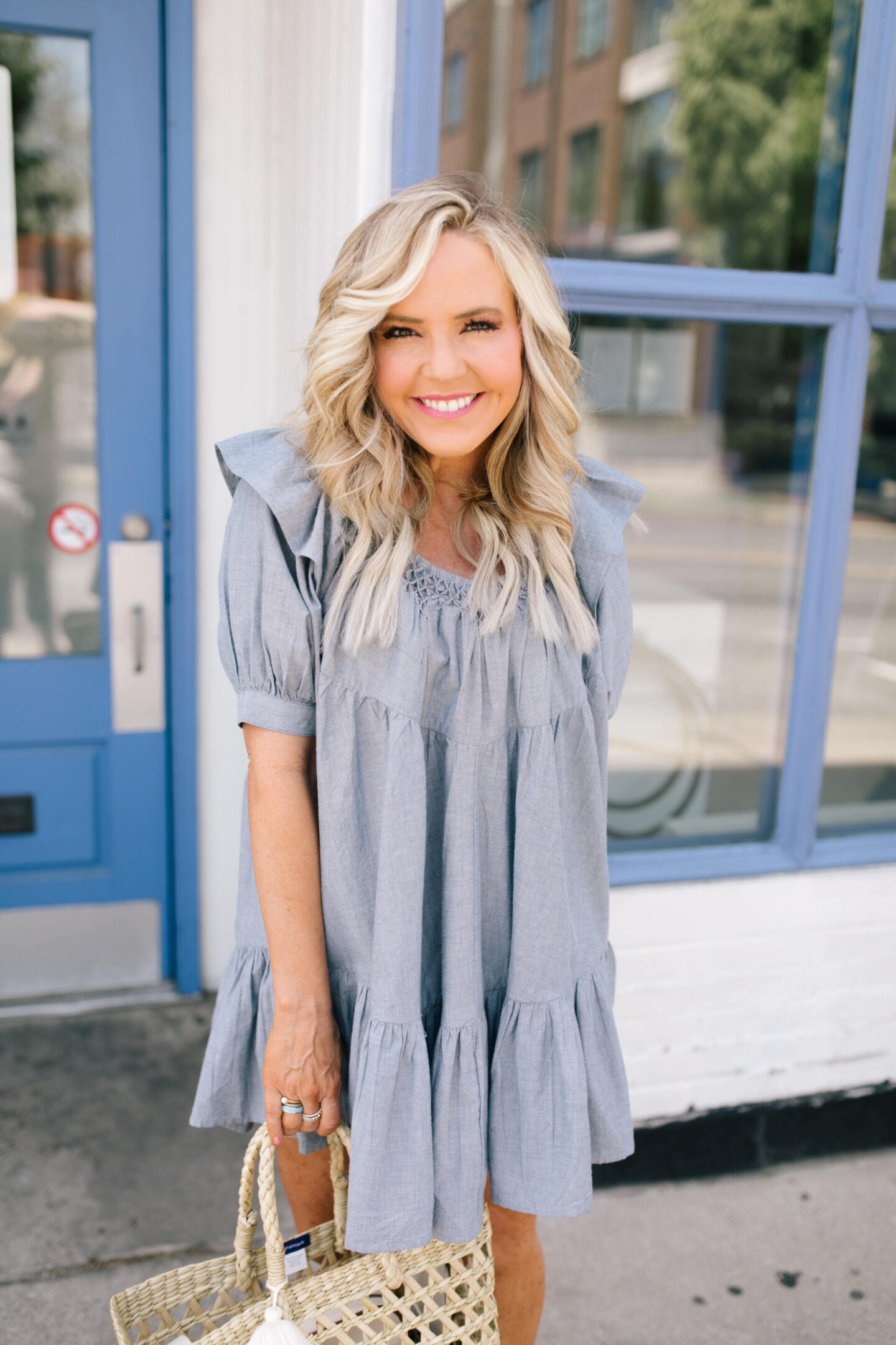 Summer Dresses by popular Nashville of Natasha Stoneking wearing a Free People Amelie Chambray mini dress and metallic knot slide sandals.