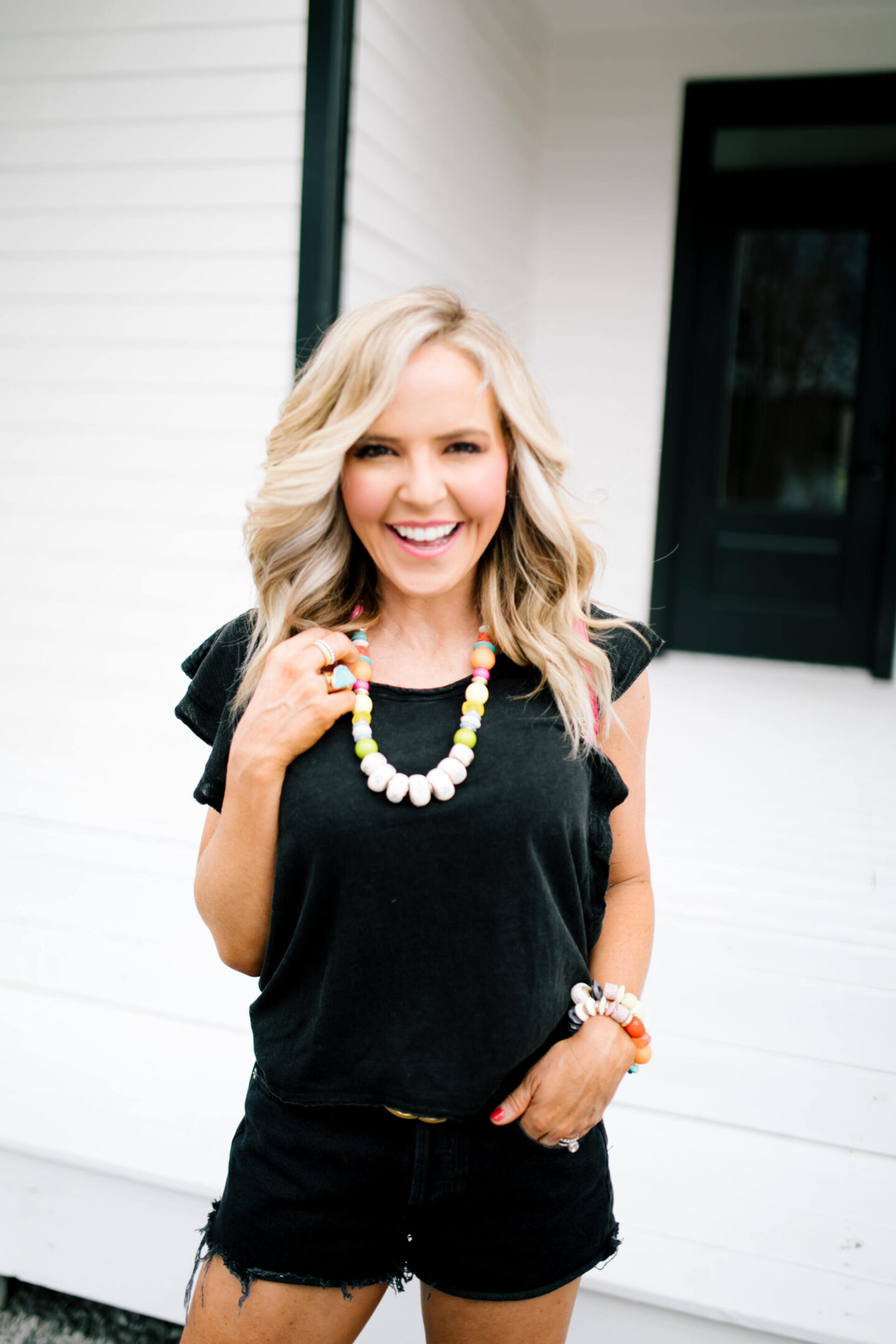 Shopbop Spring Sale by popular Nashville fashion blog, Hello Happiness: image of a woman standing outside and wearing a Shopbop Parker Cutoff Shorts.