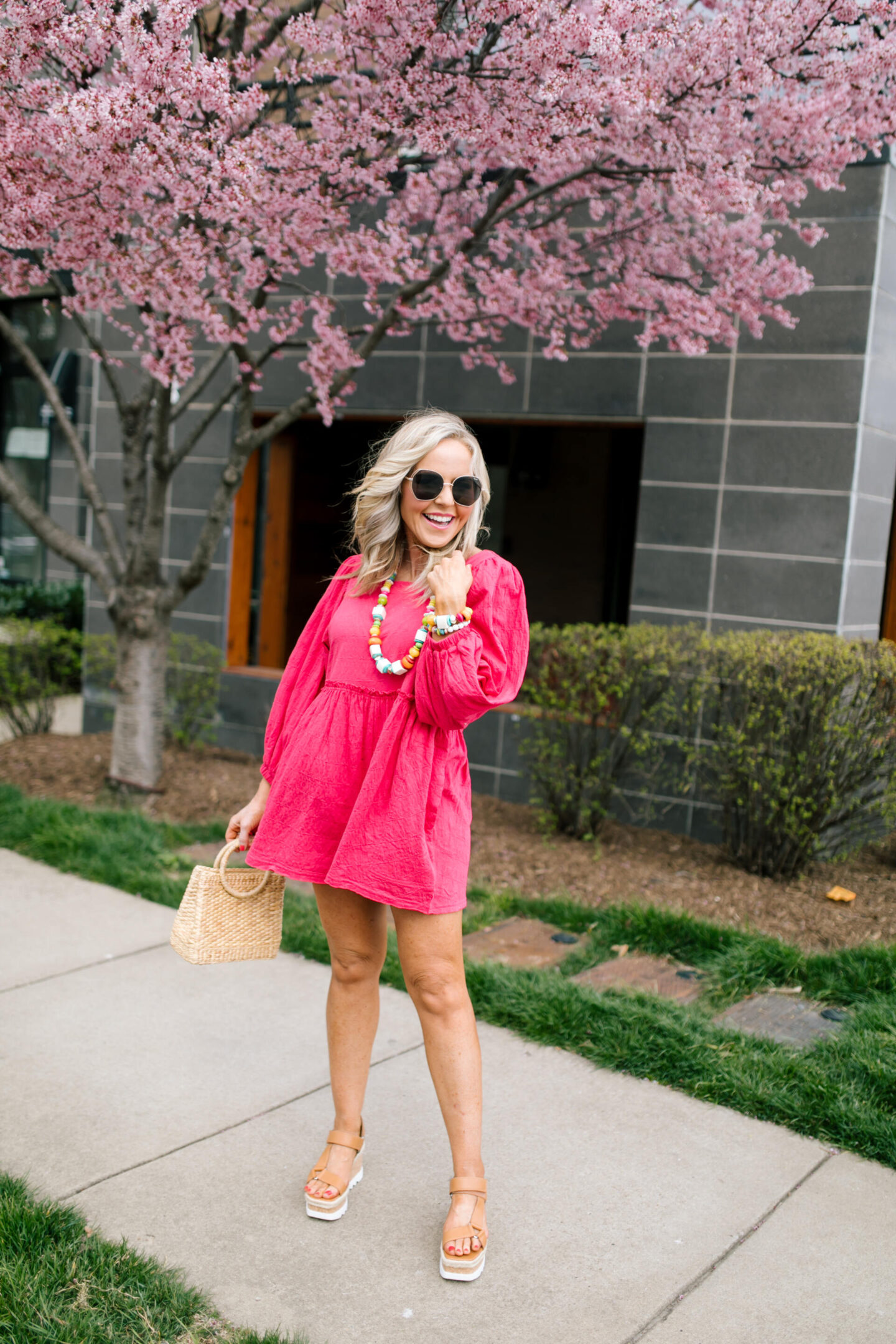 Accessory Concierge by popular Nashville fashion blog, Hello Happiness: image of Natasha Stoneking wearing a Accessory Concierge paradise City Necklace, Beyond Obsessed Romper, Platform sandal and holding a luna bag.
