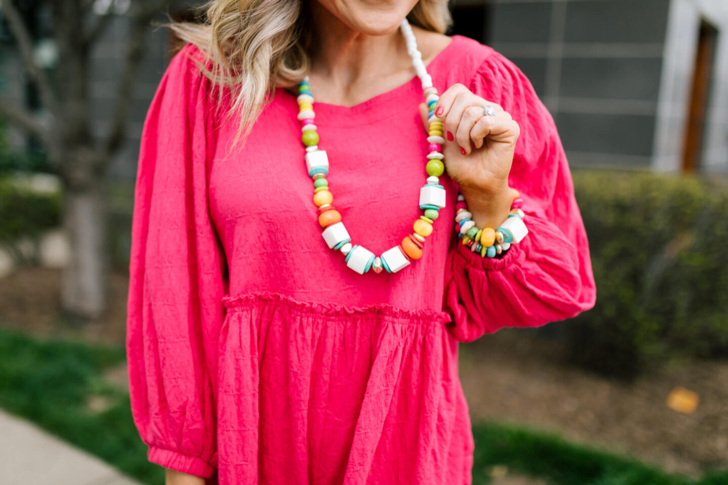 Accessory Concierge by popular Nashville fashion blog, Hello Happiness: image of Natasha Stoneking wearing a Accessory Concierge paradise City Necklace, Beyond Obsessed Romper, Platform sandal and holding a luna bag.