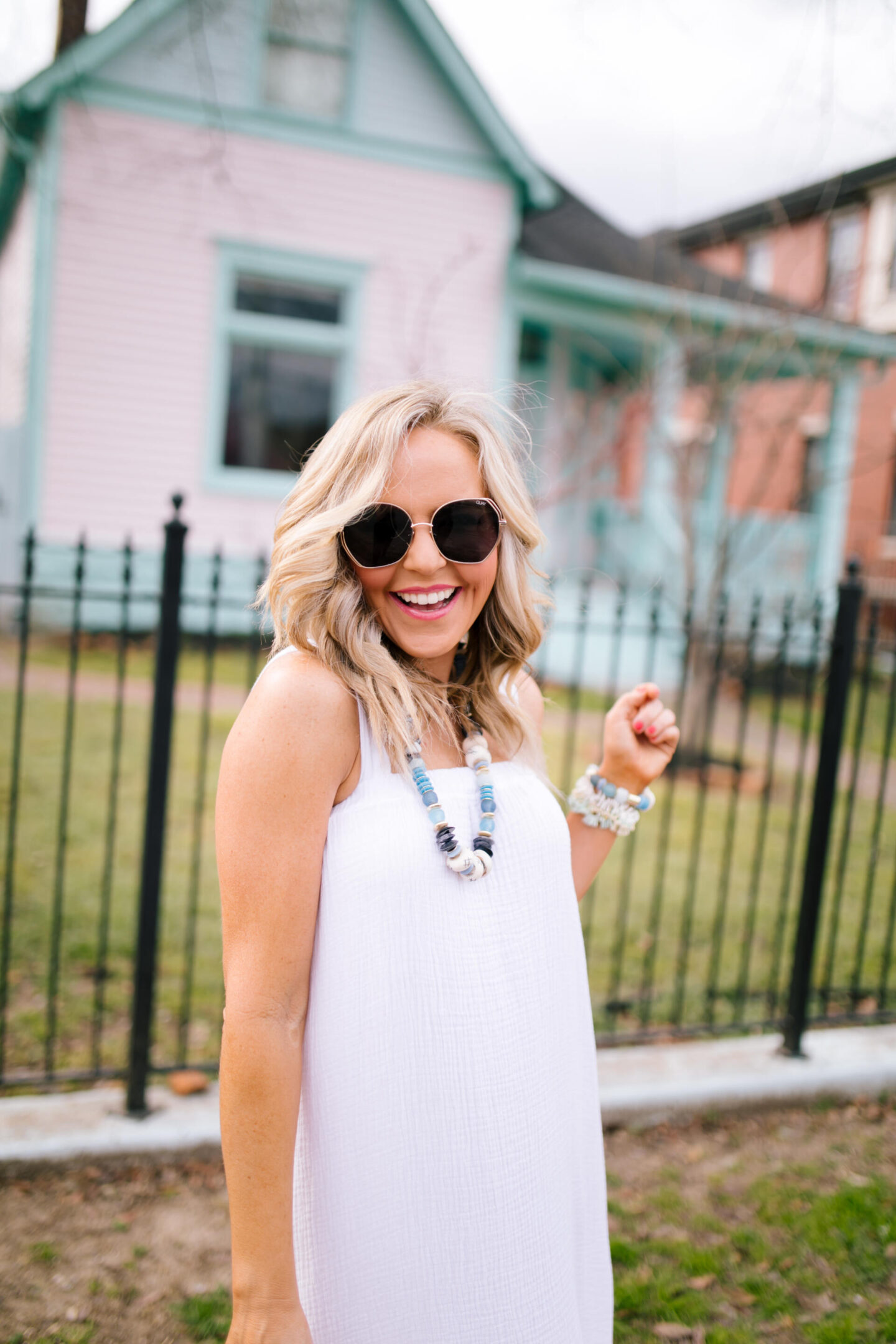 White Dresses by popular Nashville fashion blog, Hello Happiness: image of Natasha Stoneking wearing a Gauze maxi dress, Izabel studded sandal, and holding a Mallorca tote.