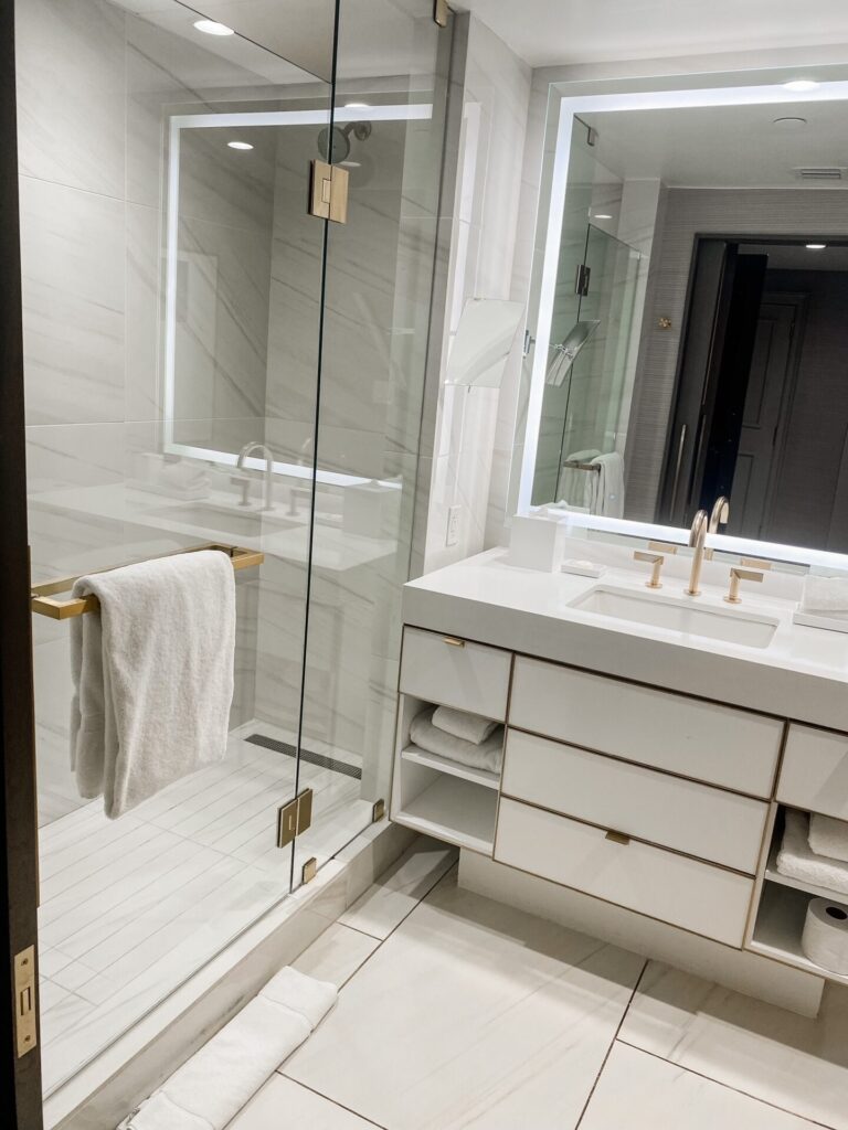 Hotel Crescent Court Dallas by popular Nashville travel blog, Hello Happiness: image of a all white modern bathroom. 