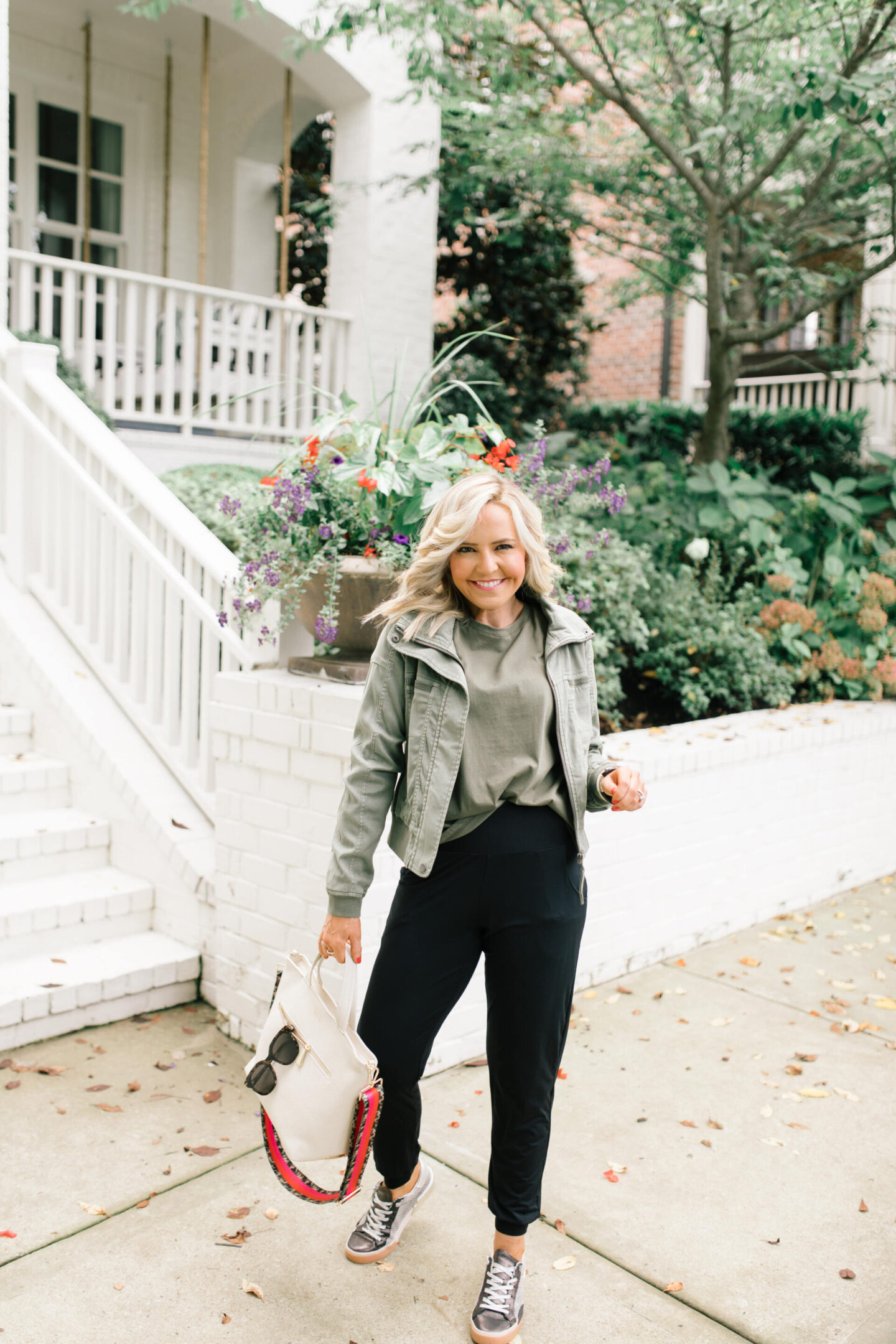 Fall Outfits by popular Nashville fashion blog, Hello Happiness: image of Natasha Stoneking wearing a Evereve Morrison jacket, commando butter jogger pants, Zina sneakers, and Shoulder pad tee.