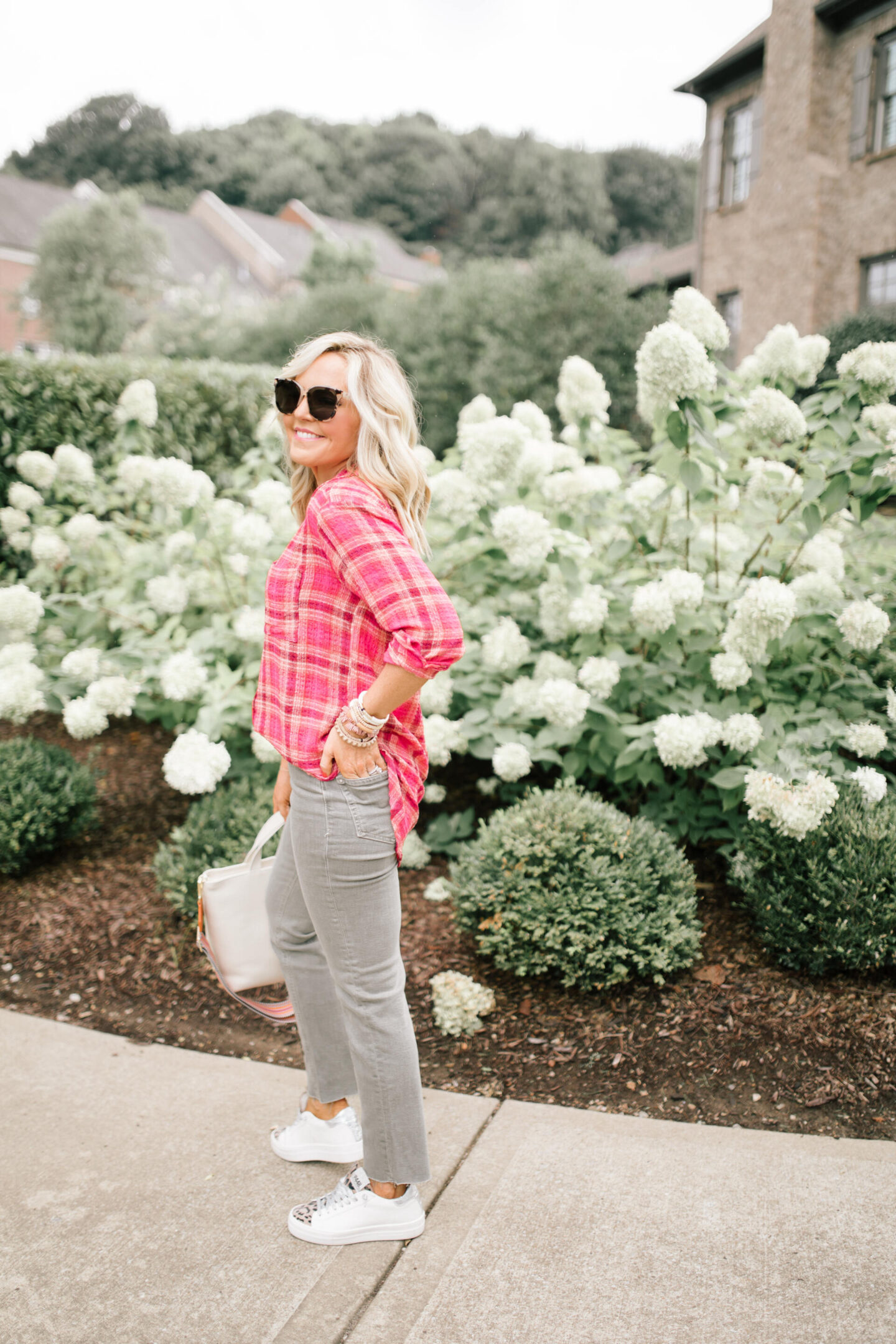 Pilcro Jeans by popular Nashville fashion blog, Hello Happiness: image of Natasha Stoneking wearing Pilcro vintage straight jeans, plaid tunic top and p448 sneakers.