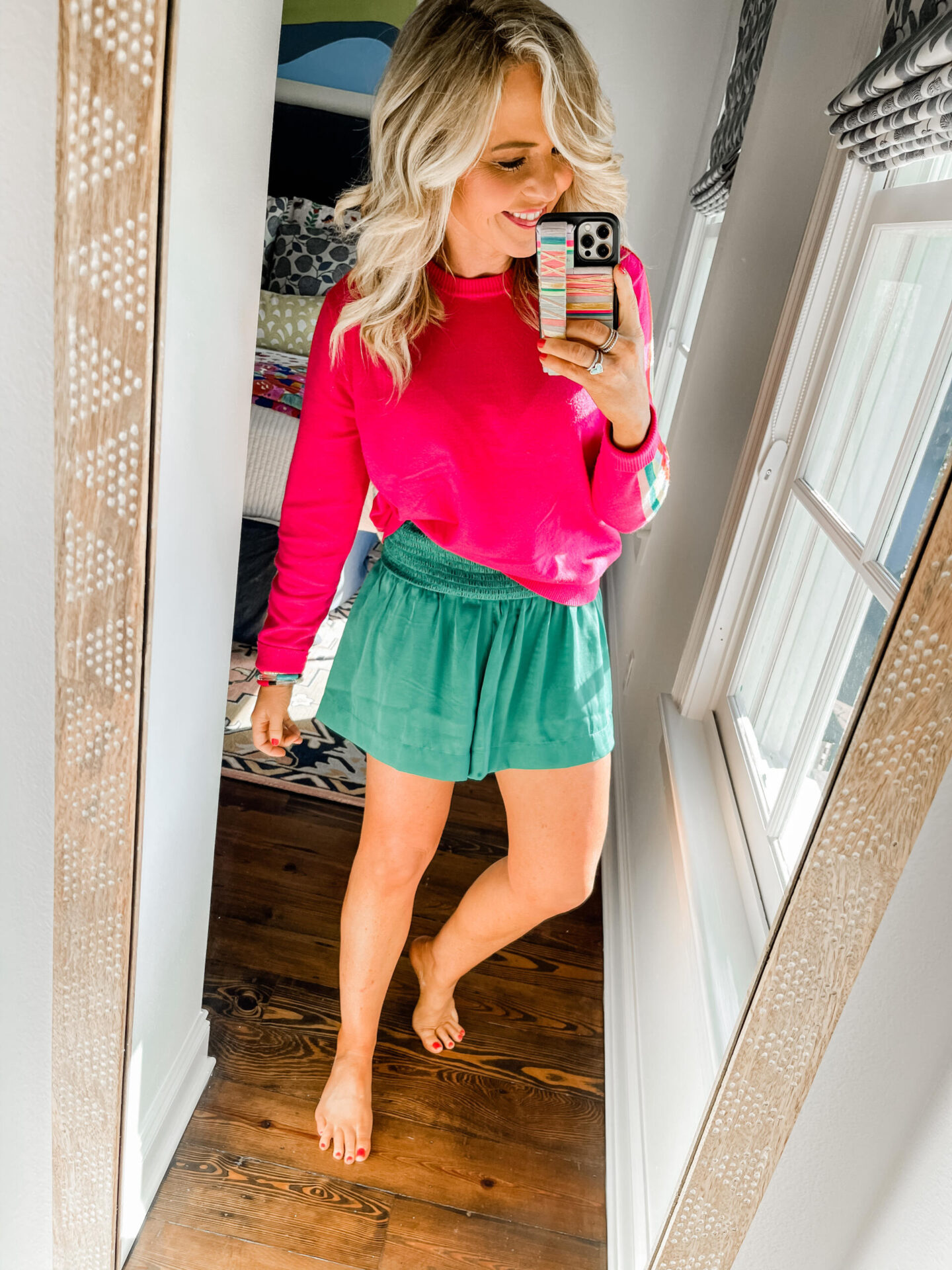 Spring Break Outfits by popular Nashville fashion blog, Hello Happiness: image of Natasha Stoneking wearing a Madison Stripe Sweater and Laura Shorts.