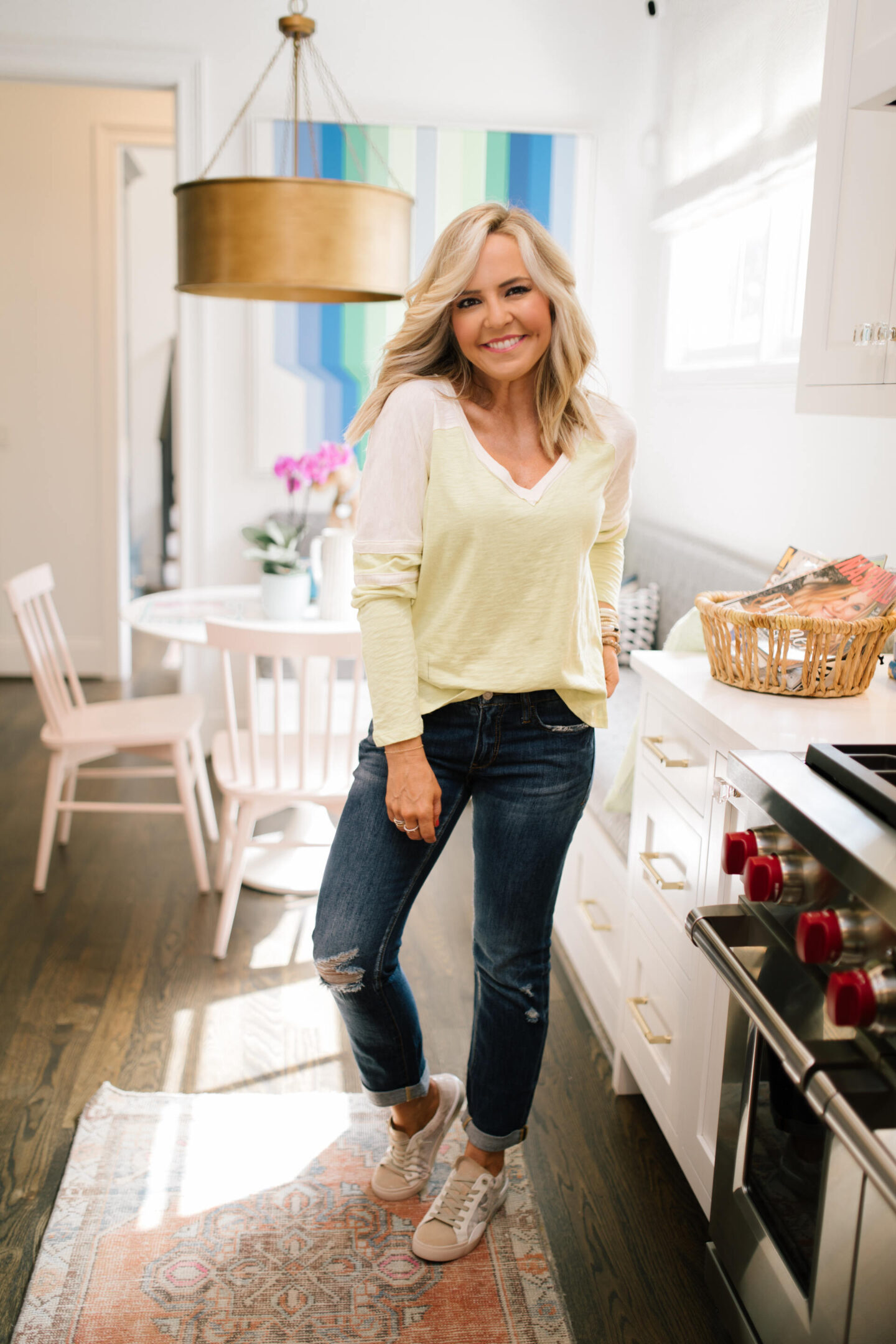 Pilcro Jeans by popular Nashville fashion blog, Hello Happiness: image of Natasha Stoneking wearing Pilcro slim boyfriend jeans, v-neck graphic tee, and p448 sneakers.
