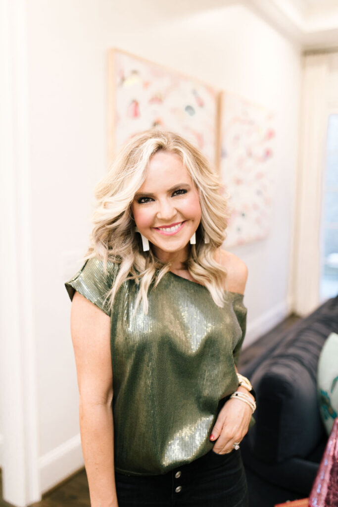 Gibsonlook by popular Nashville fashion blog, Hello Happiness: image of a Natasha Stoneking wearing a green metallic top and black jeans.