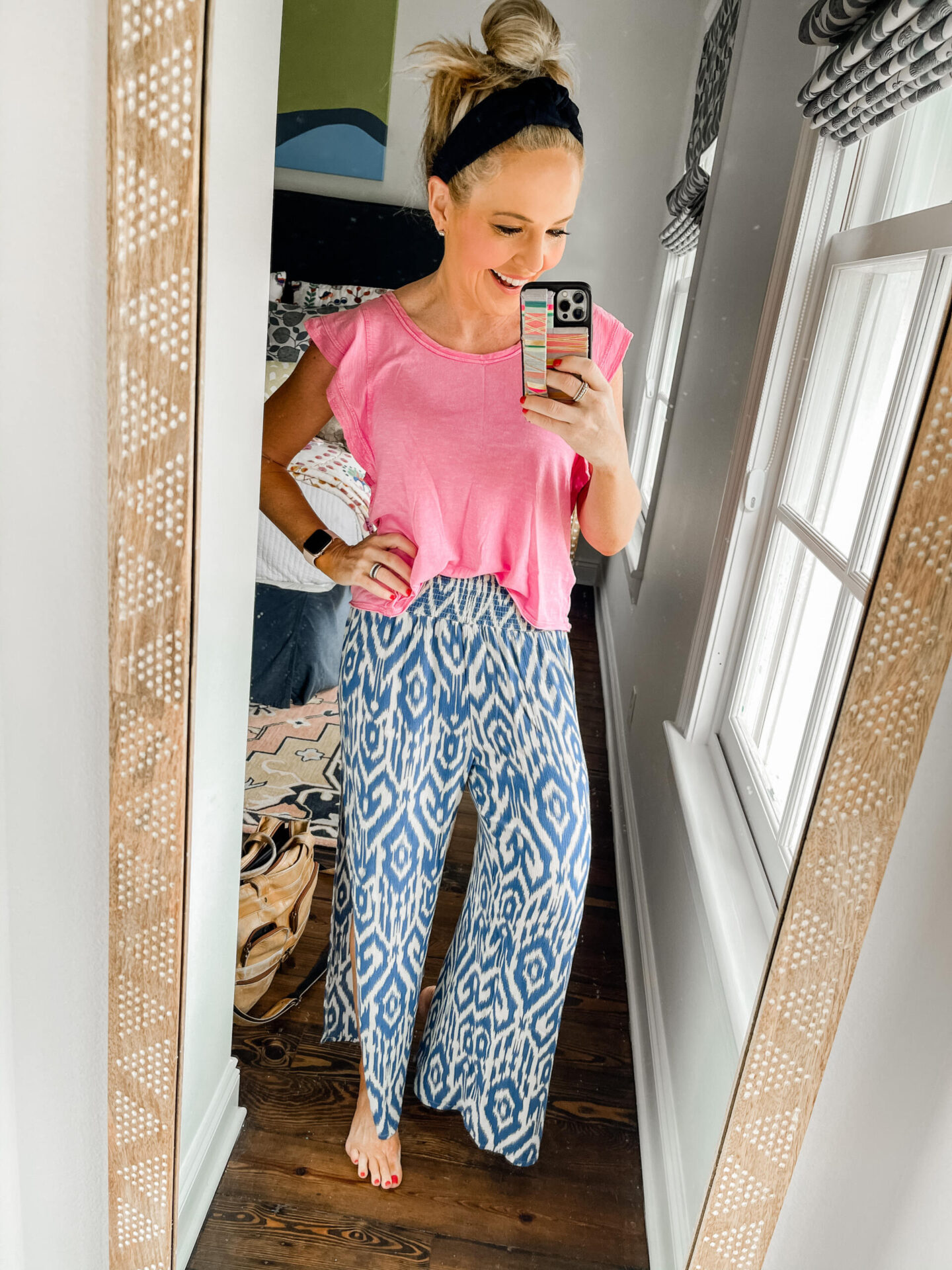 Spring Break Outfits by popular Nashville fashion blog, Hello Happiness: image of Natasha Stoneking wearing a flutter sleeve tee, wide leg pants, and a woven headband.