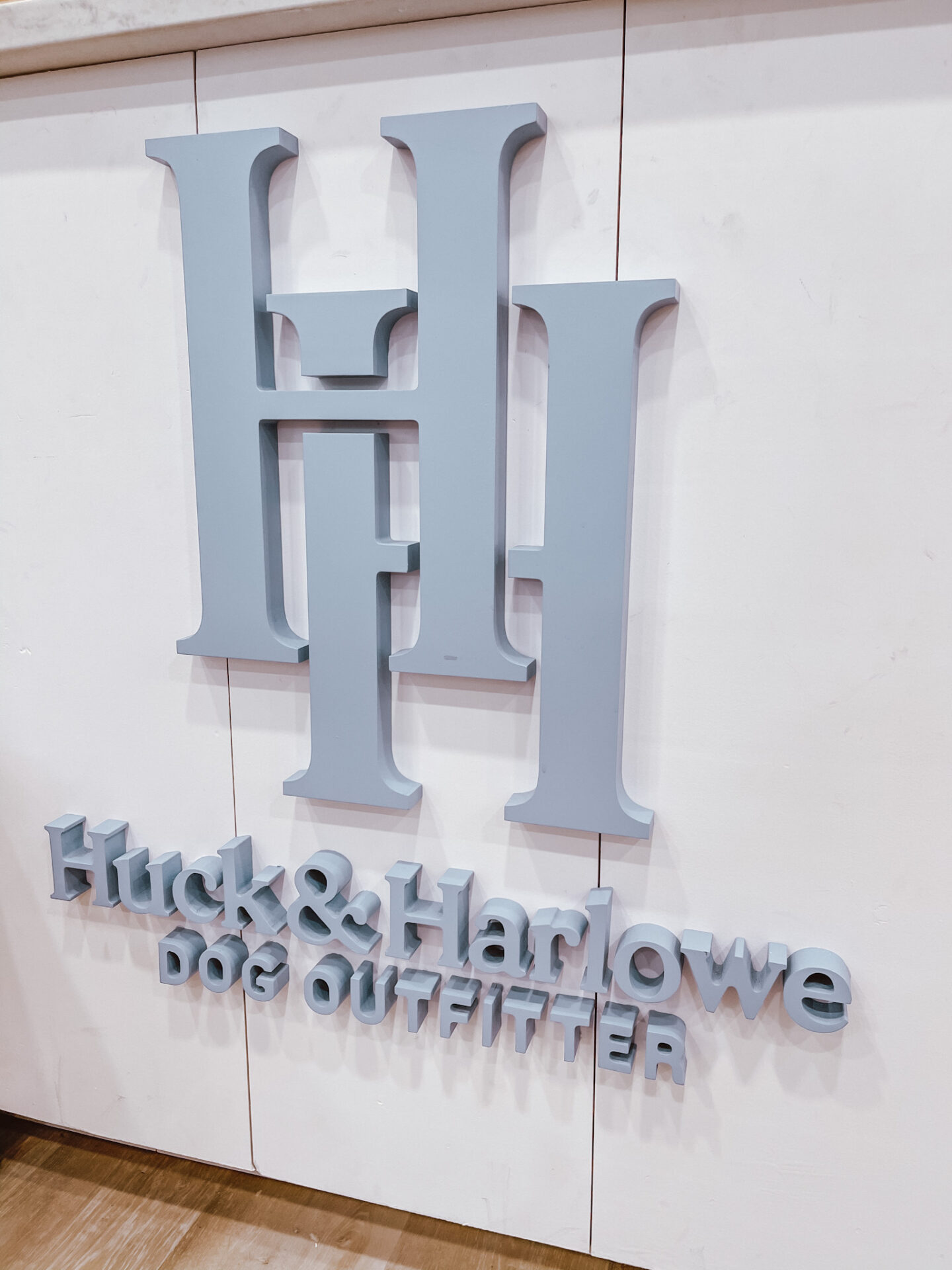Dog Shops by popular Nashville lifestyle blog, Hello Happiness: image of a Huck and Harlowe sign.
