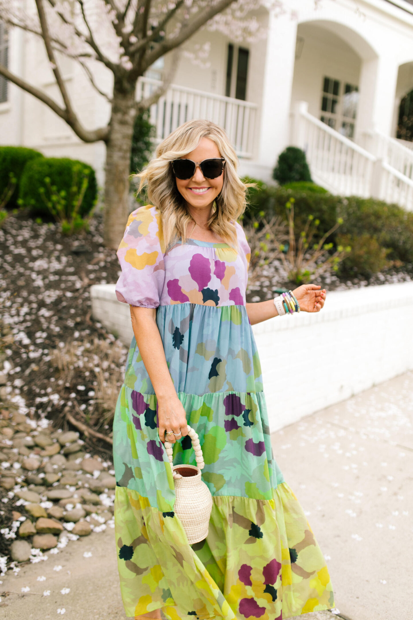 Purple Clothing by popular Nashville fashion blog, Hello Happiness: image of a woman wearing a Caroline Tiered midi, Raye Platforms, and holding a bucket bag.