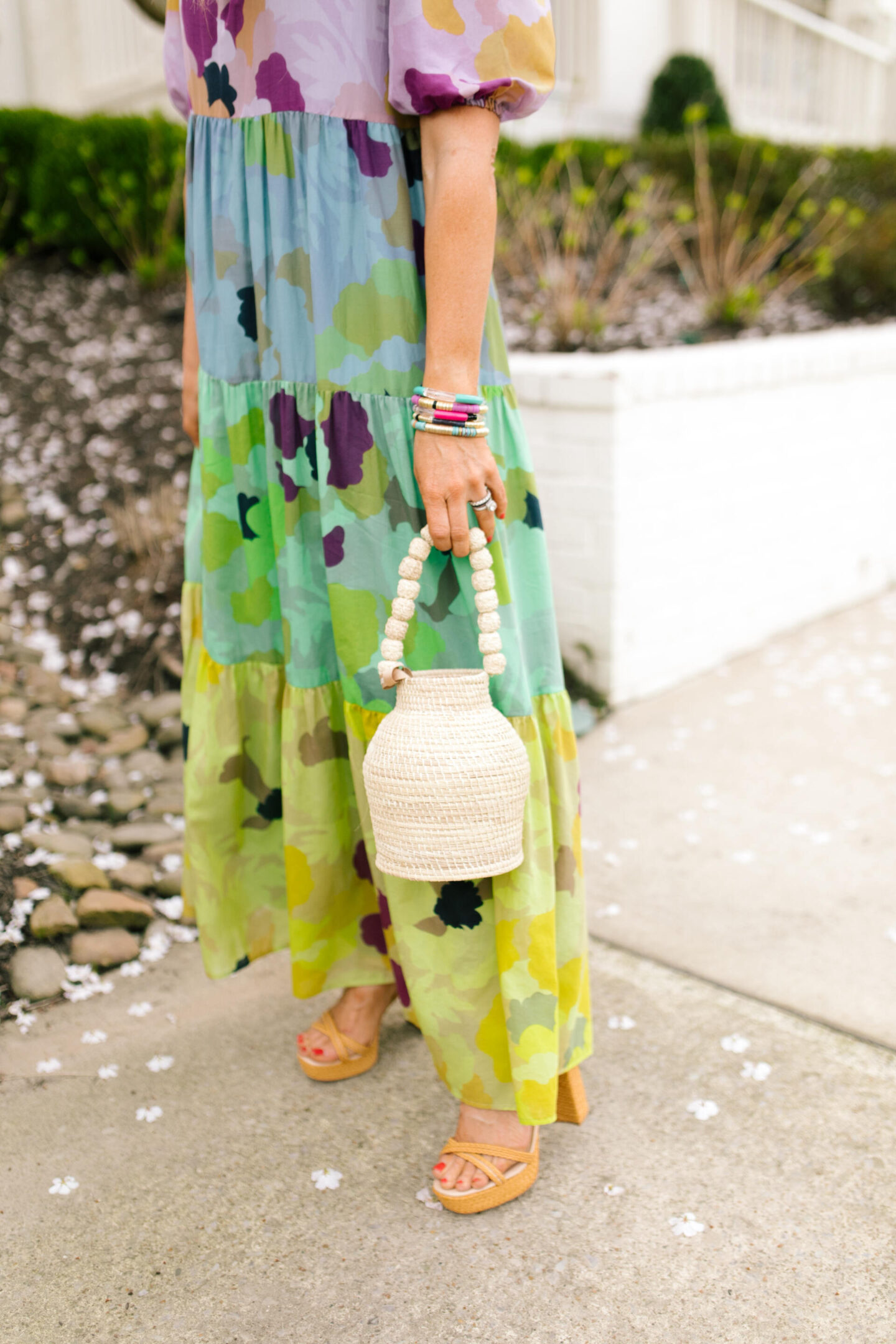 Woven Bag by popular Nashville fashion blog, Hello Happiness: image of a woman holding a San Gil bucket bag.