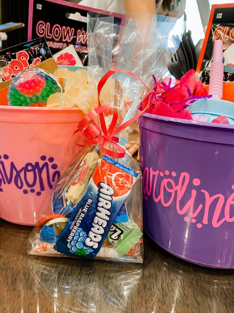 Gaylord Soundwaves by popular Nashville lifestyle blog, Hello Happiness: image of personalized party favor buckets filled with Poprocks, Airheads, bubble gum, and Glow Wands. 