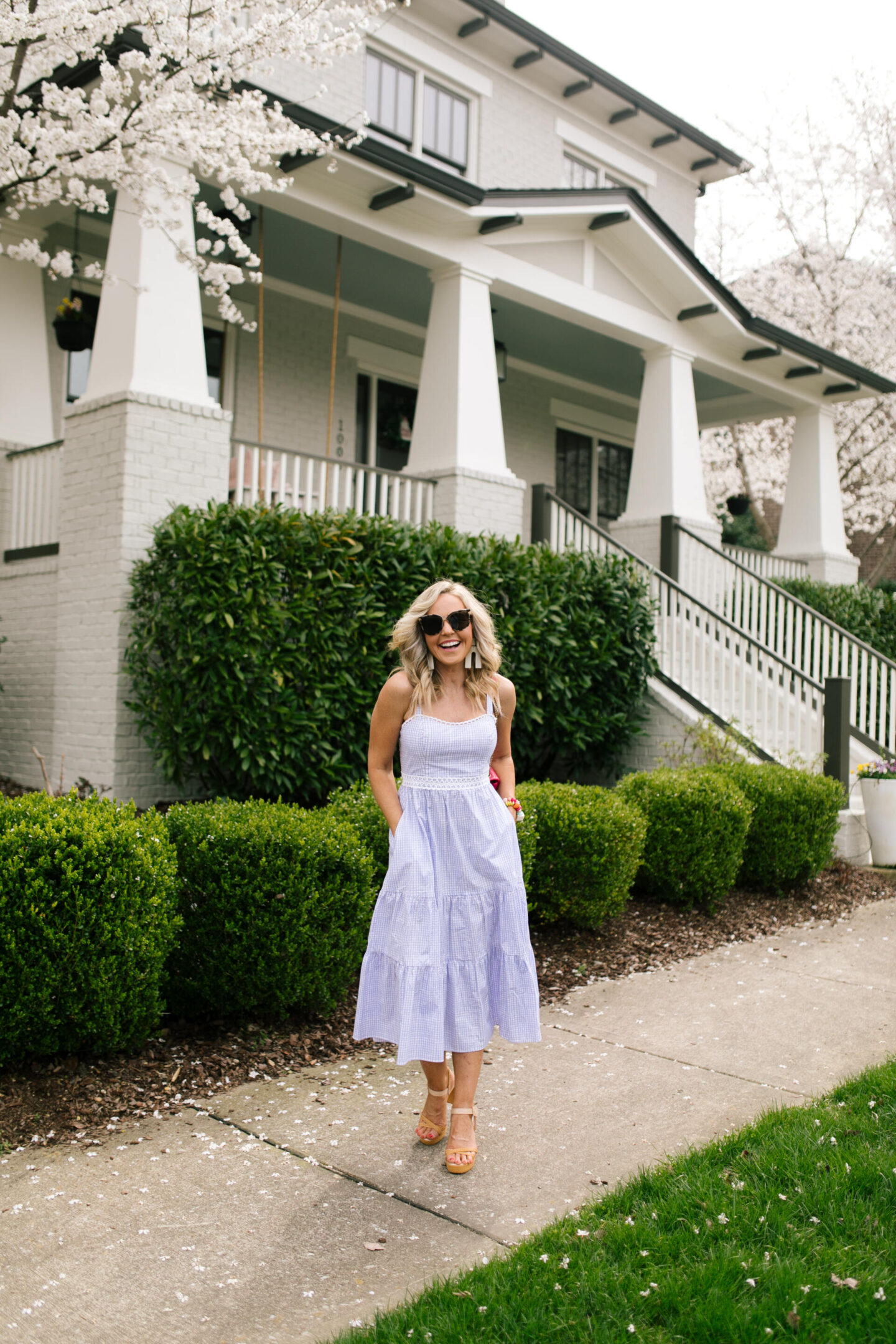 Purple Clothing by popular Nashville fashion blog, Hello Happiness: image of a woman wearing a Olivet stretch midi, Raye platforms, After hours sunglasses, and Sunshine tienda earrings.