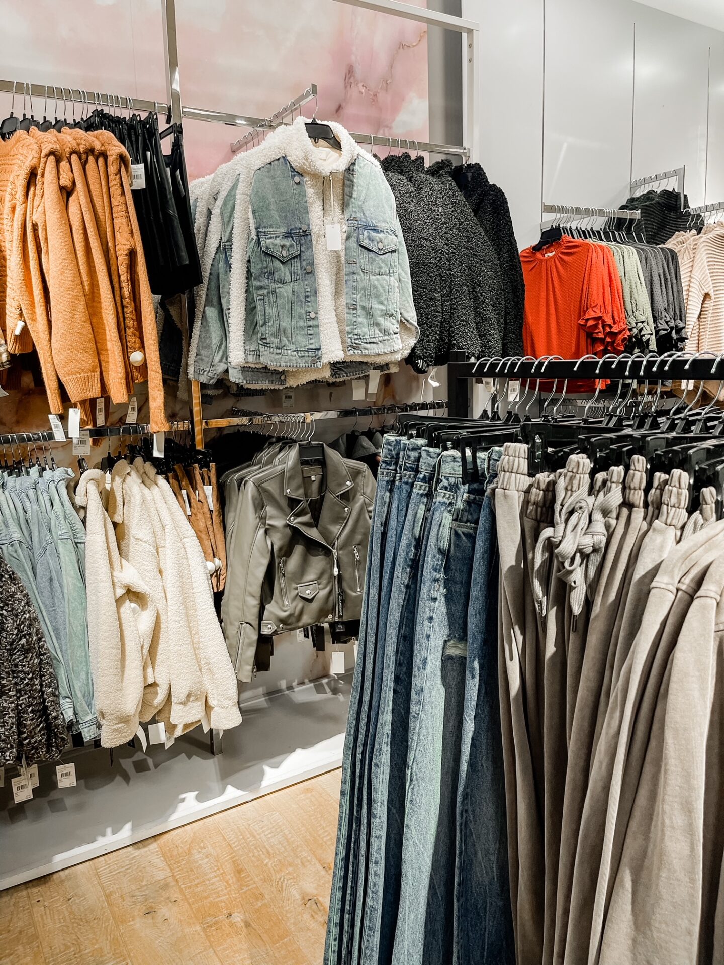 Nordstrom Anniversary Sale by popular Nashville fashion blog, Hello Happiness: image of Nordstrom clothing hanging on clothing racks.