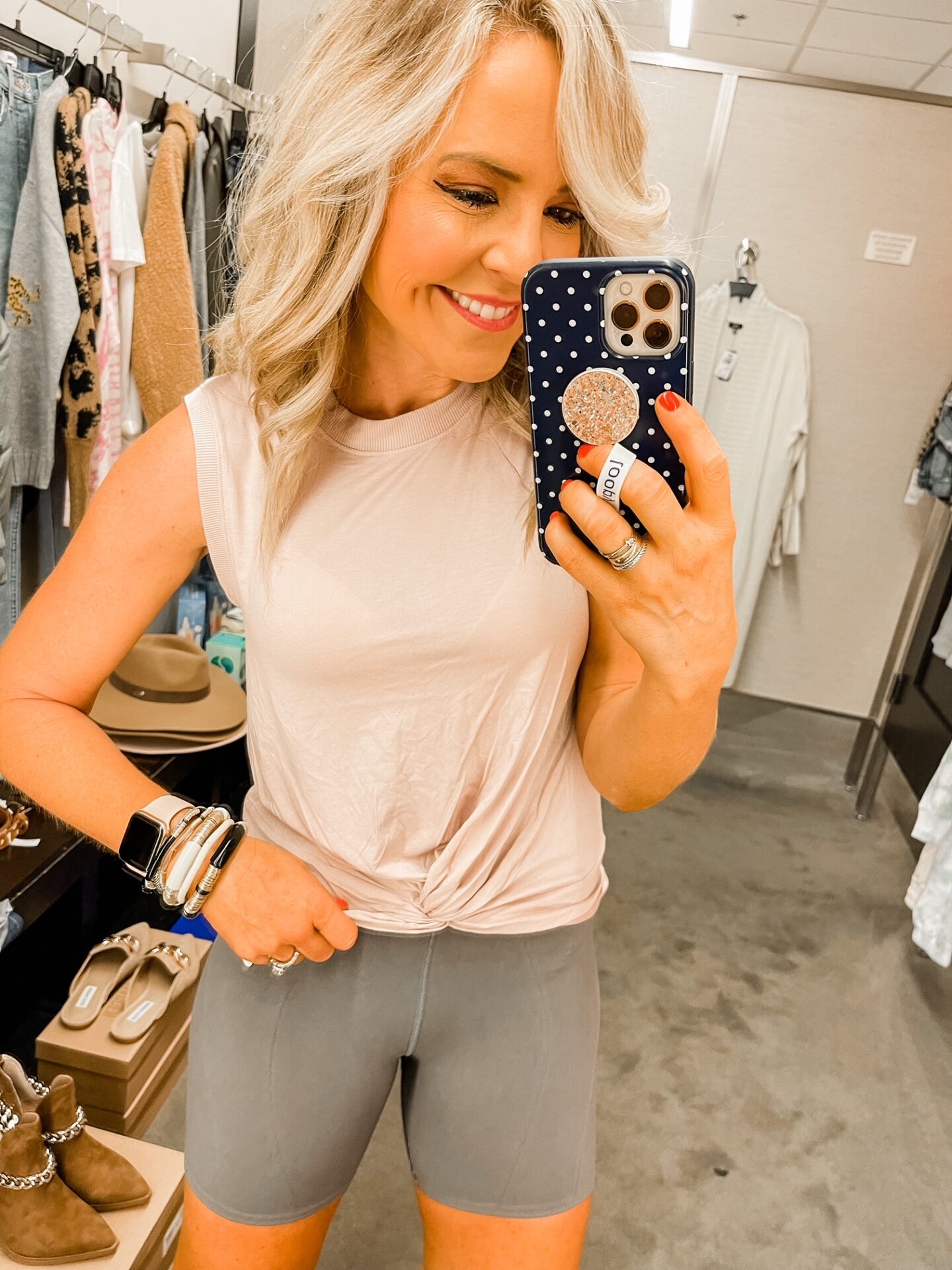 Nordstrom Anniversary Sale by popular Nashville fashion blog, Hello Happiness: image of Natasha Stoneking wearing a Nordstrom let's go seamless bike shorts and Zella twist front tank. 