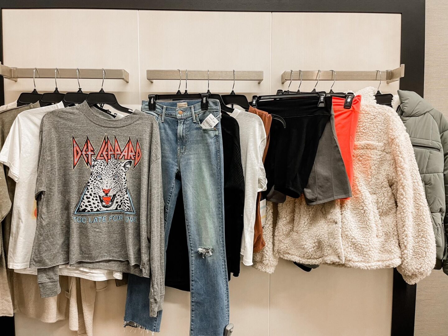 Nordstrom Anniversary Sale by popular Nashville fashion blog, Hello Happiness: image of Nordstrom women's clothing hanging on clothing racks. 