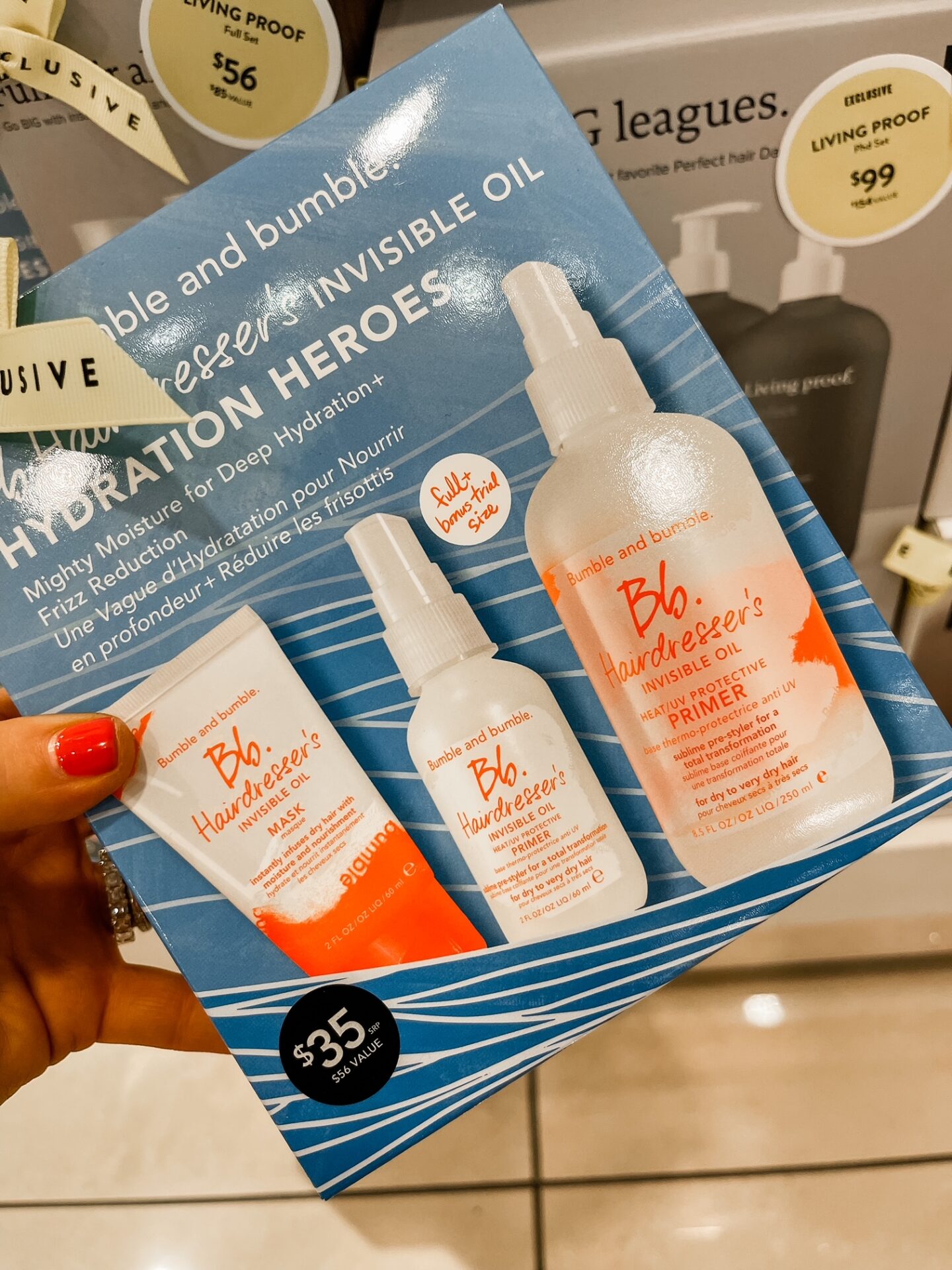 Nordstrom Anniversary Sale by popular Nashville fashion blog, Hello Happiness: image of Natasha Stoneking holding a Nordstrom Bb. Hairdresser's Invisible oil set.