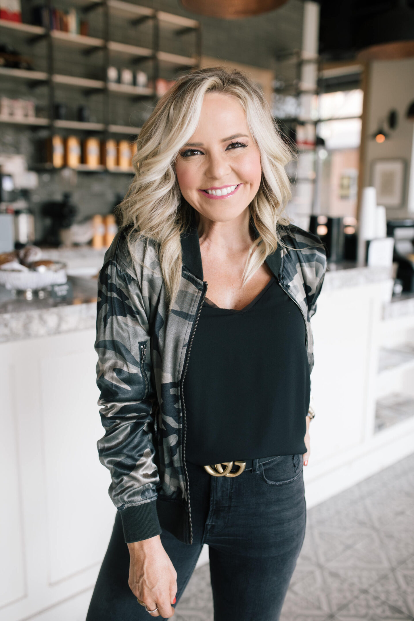 Fall Outfits by popular Nashville fashion blog, Hello Happiness: image of Natasha Stoneking wearing a Evereve camo bomber jacket, chiffon cami and good classic denim.