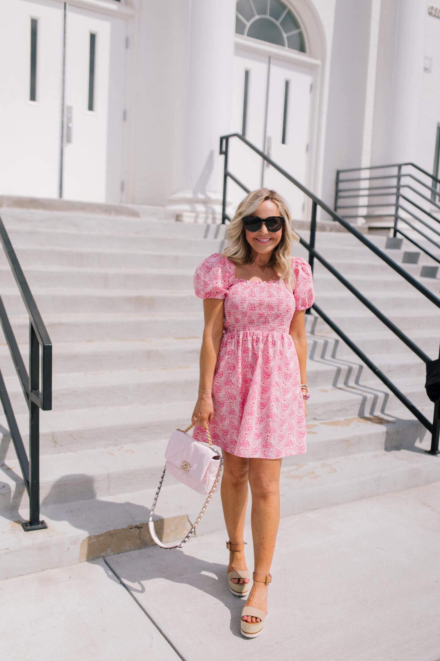 Revolve Clothing by popular Nashville fashion blog, Hello Happiness: image of Natasha Stoneking wearing a Revolve Pippa short dress, Revolve Raye Platform sandals, Revolve Kaanas bucket bag, and some stack bracelets.