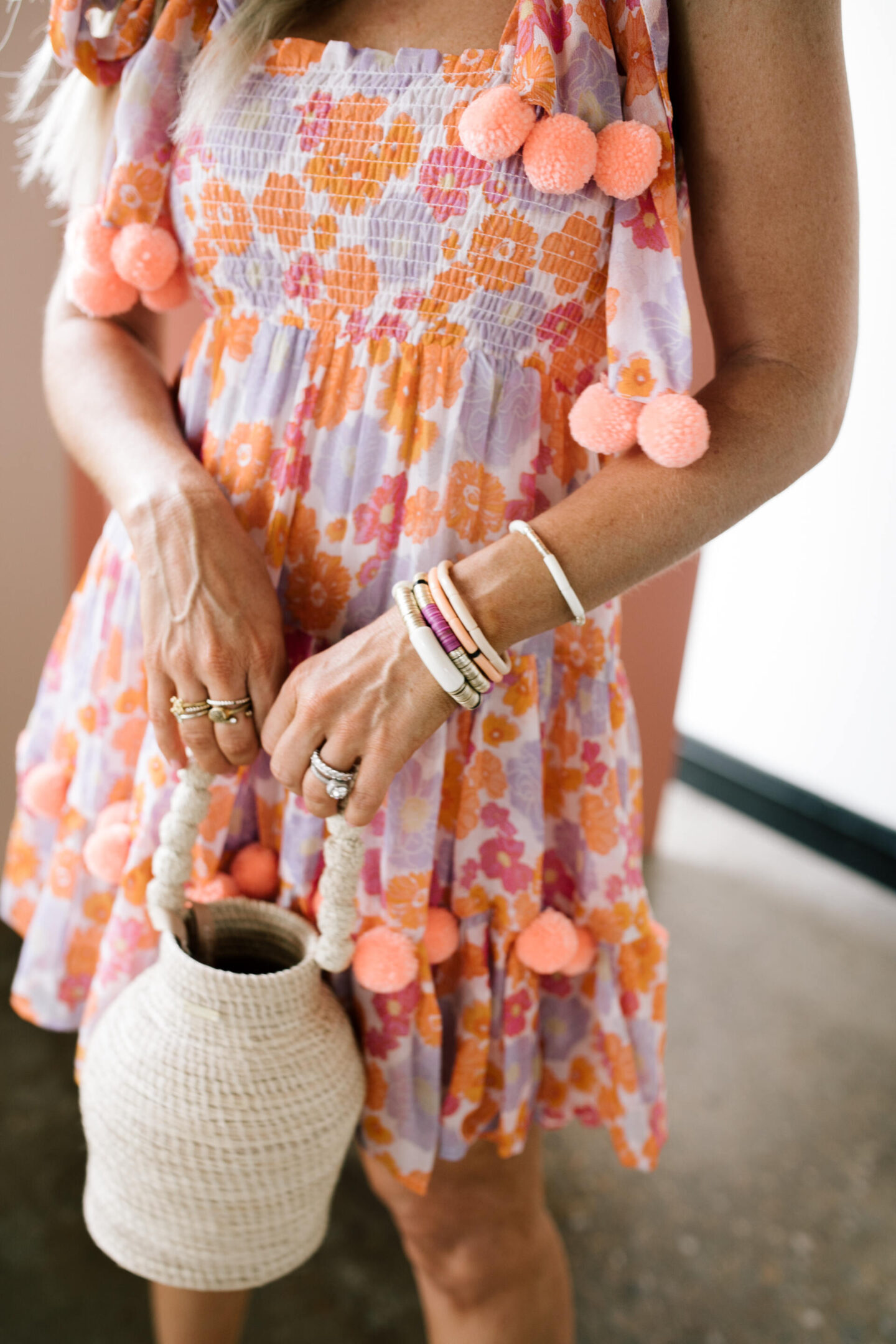 Revolve Clothing by popular Nashville fashion blog, Hello Happiness: image of Natasha Stoneking wearing a Revolve Pippa short dress, Revolve Raye Platform sandals, Revolve Kaanas bucket bag, and some stack bracelets.