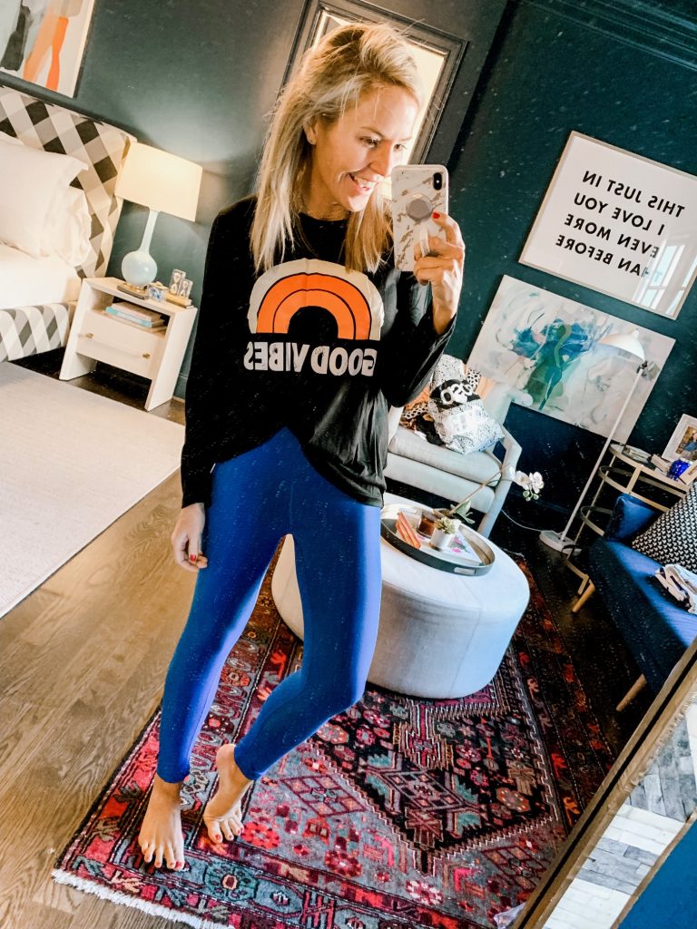Amazon Favorites featured by top US fashion blog Hello! Happiness; Image of a woman wearing Good Vibes tee from Amazon.