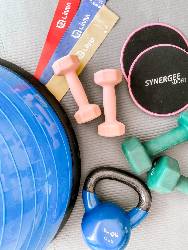 Favorite Things on Amazon by popular Nashville life and style blog, Hello Happiness: image of core sliders, resistant band set, hand weights, yoga mat, and Bosu ball.  