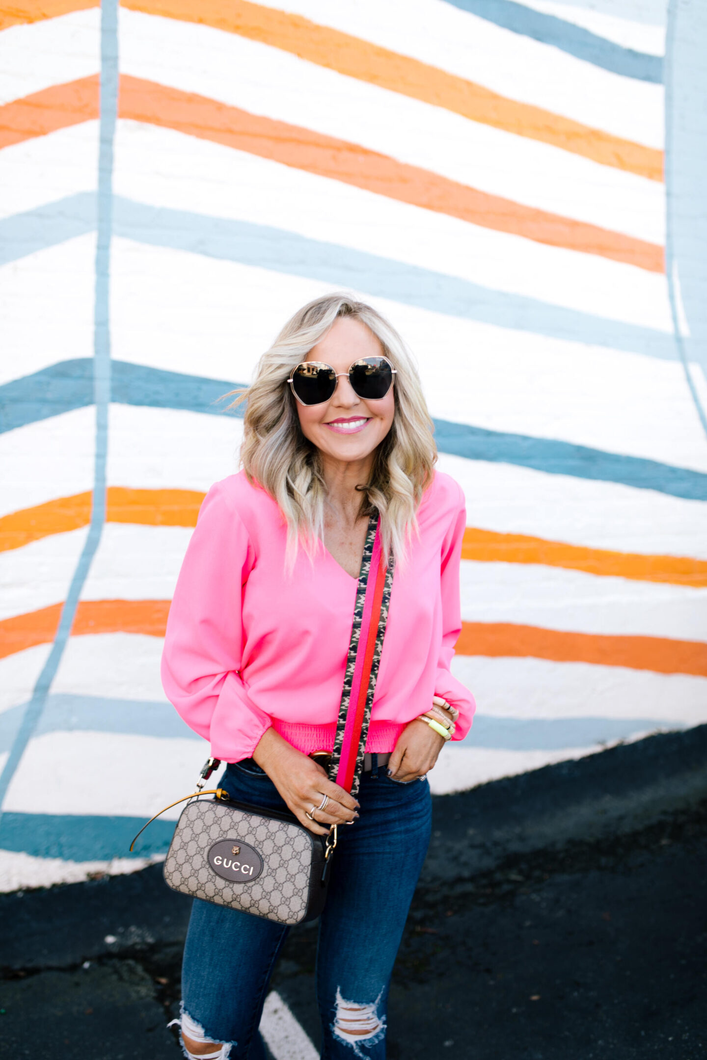 Bag Straps by popular Nashville fashion blog, Hello Happiness:image of Natasha Stoneking carrying a bag with a Social Threads bag strap.
