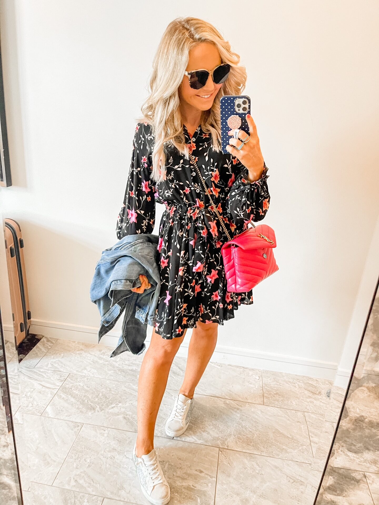 Girls Getaway by popular Nashville travel blog, Hello Happiness: image of Natasha Stoneking wearing a black and pink floral print dress, silver glitter sneakers, and a pink YSL bag. 