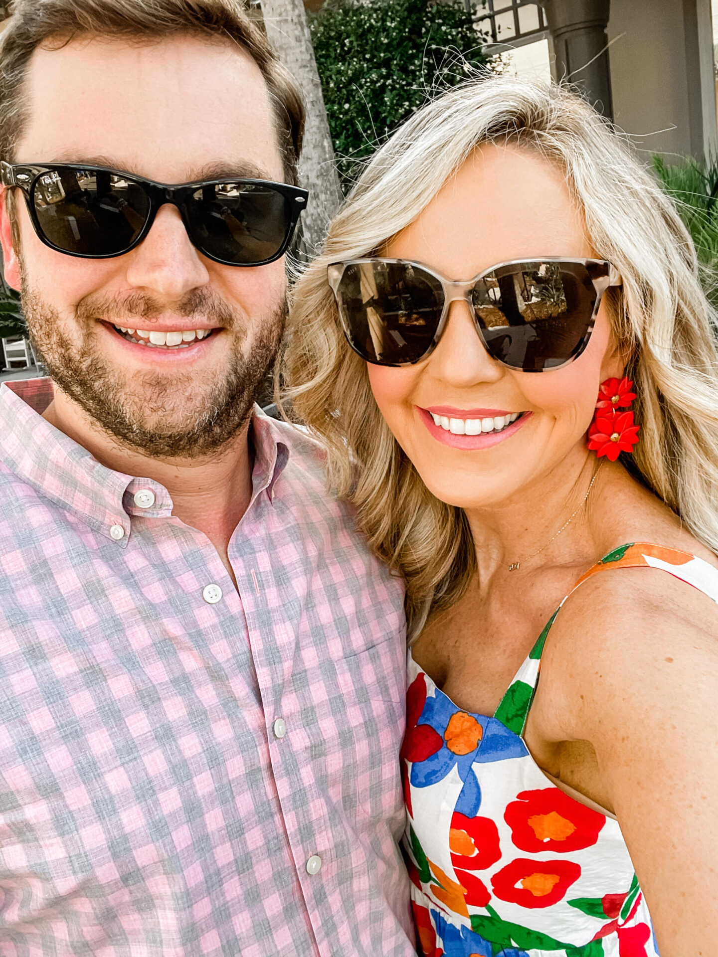 Best Father's Day Gifts by popular Nashville life and style blog, Hello Happiness: image of man and woman wearing sunglasses and standing together outside.