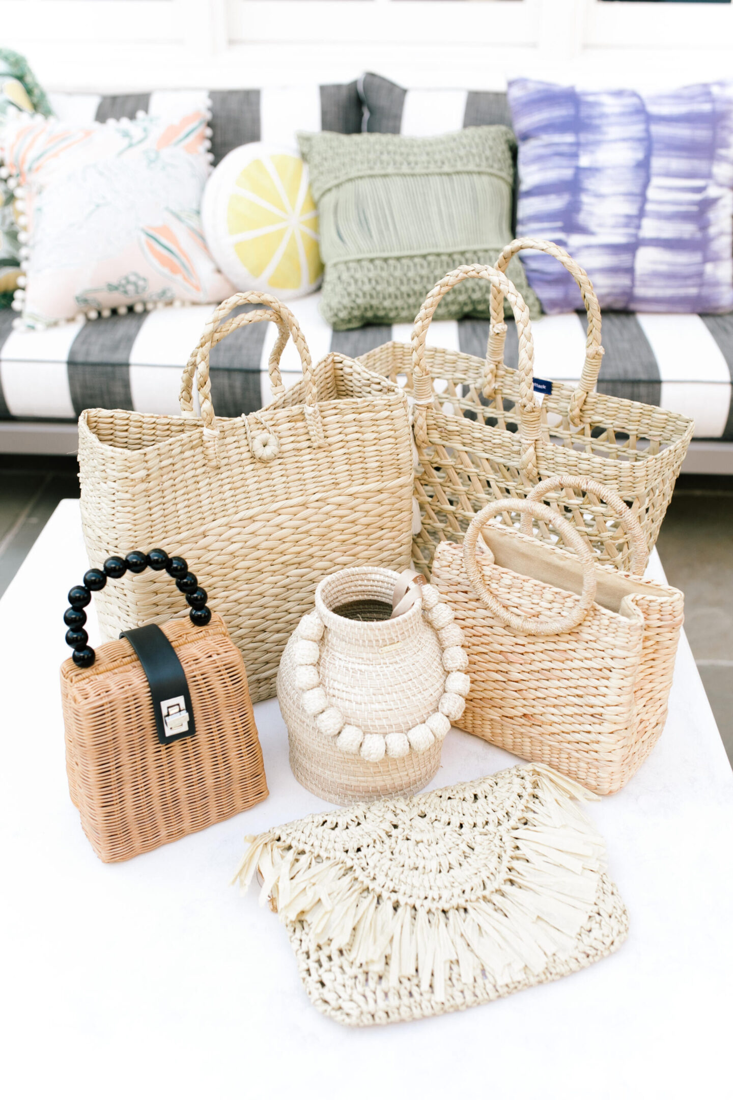 Woven Bag by popular Nashville fashion blog, Hello Happiness: image of wicker bags, woven bags, and a raffia clutch.