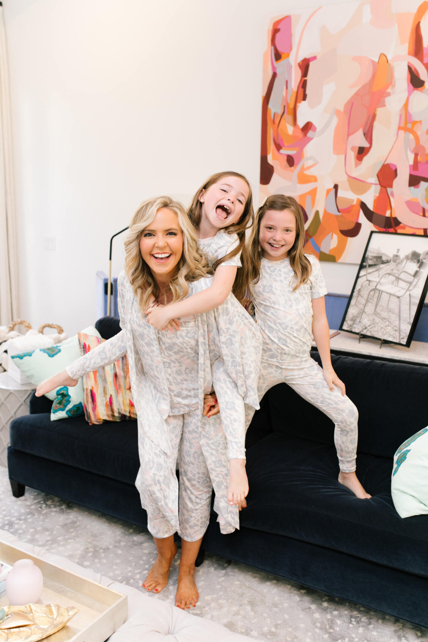 Mommy and Me Pajamas by popular Nashville fashion blog, Hello Happiness: image of a mom and her two daughters wearing leopard print Soma Intimates mommy and me pajamas.