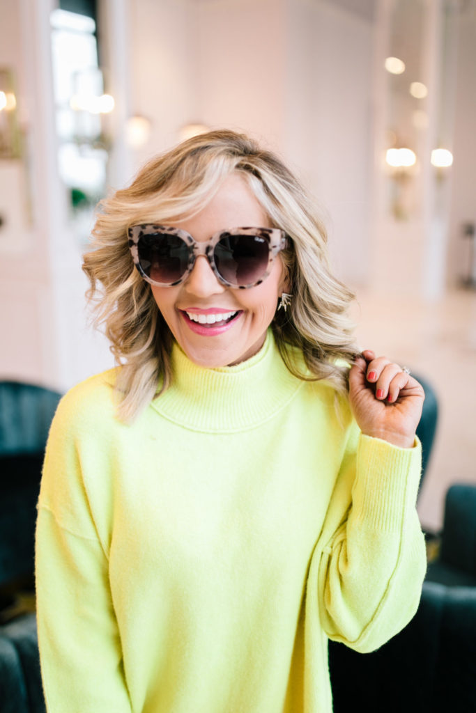 Shopbop Sale by popular Nashville fashion blog, Hello Happiness: image of a woman wearing a Shopbop Free People Free People Afterglow Mock Neck Sweater and Shopbop Baublebar earrings. 