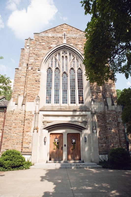 10 Year Wedding Anniversary by popular Nashville lifestyle blog, Hello Happiness: image of a cathedral with moss covered letter N and letter J wreaths hanging on it's front doors.
