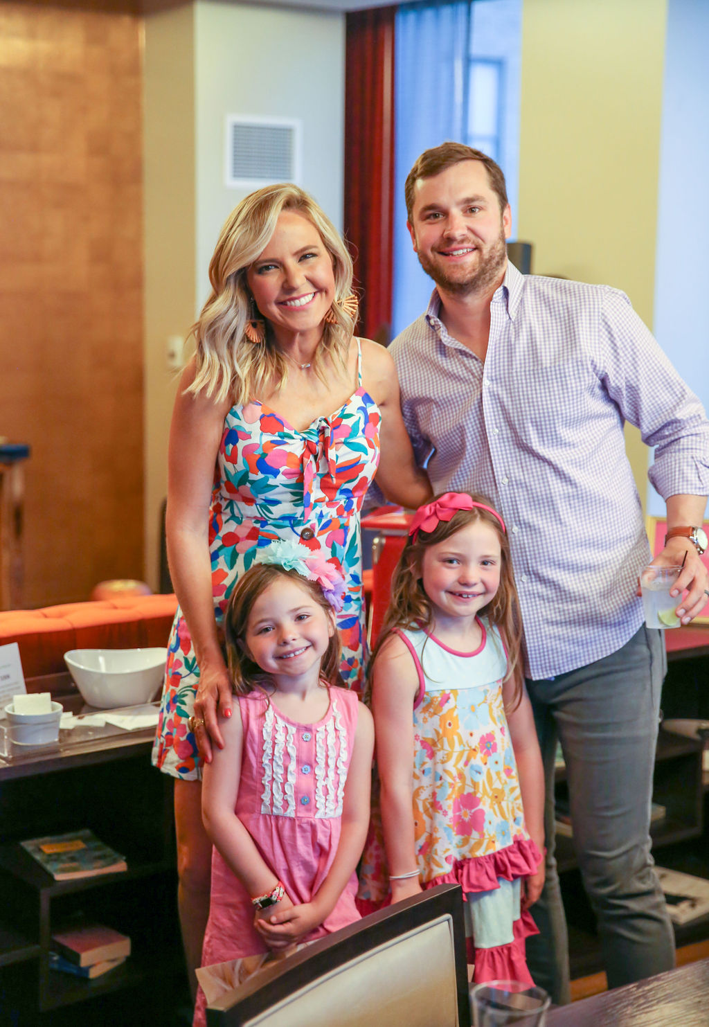 10 Year Wedding Anniversary by popular Nashville lifestyle blog, Hello Happiness: image of a mom and dad and their two young daughter standing together.
