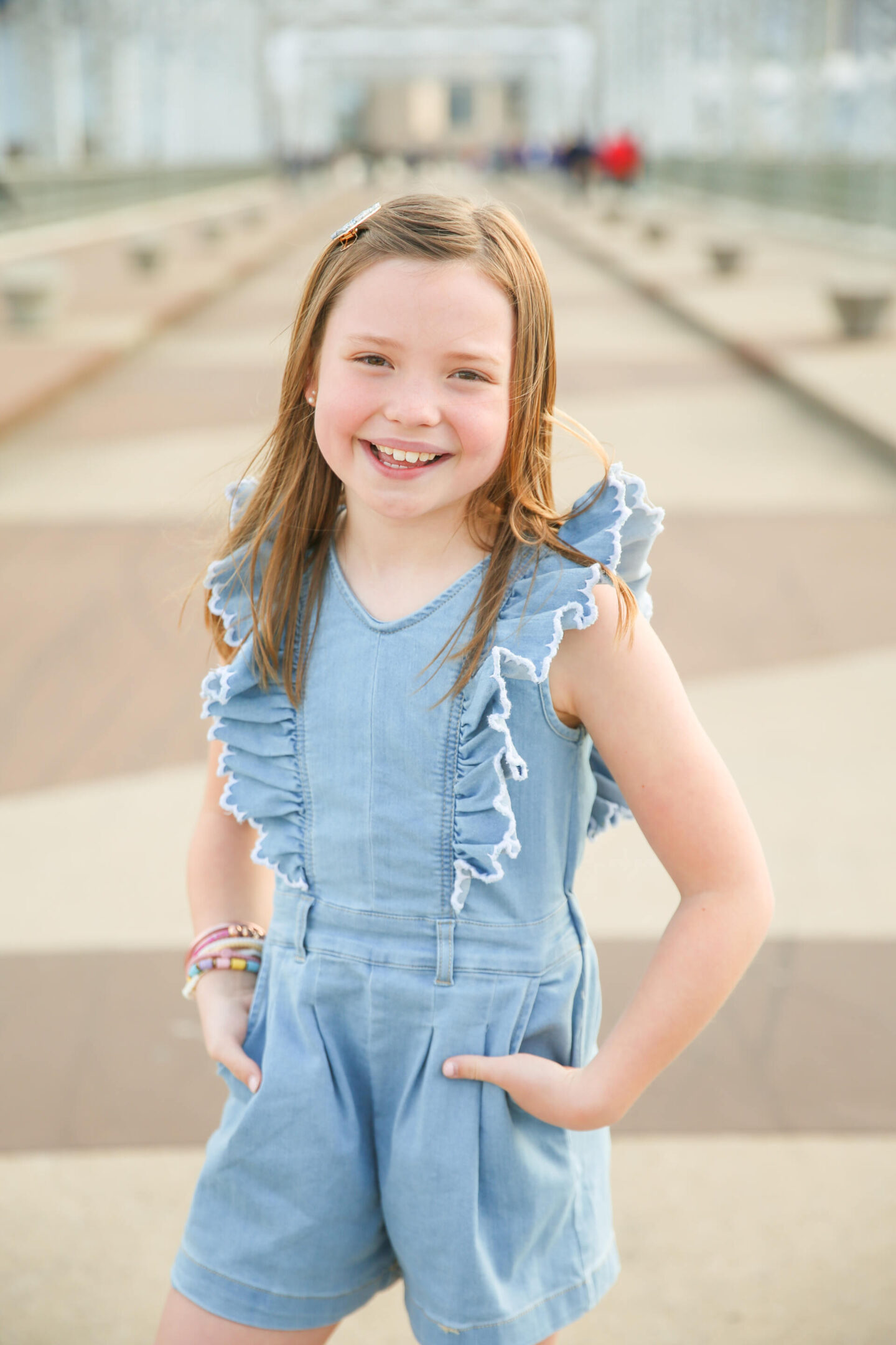 Summer Bucket List by popular Nashville lifestyle blog, Hello Happiness: image of a young girl wearing a chambray romper and brown sandals.