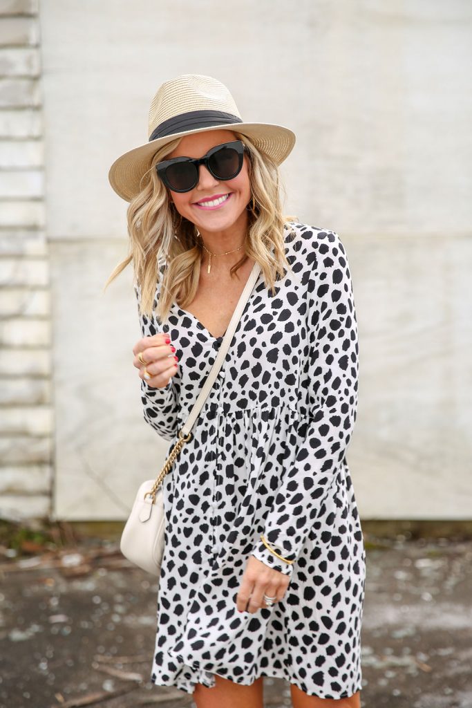 Shopbop Sale featured by top US fashion blog Hello! Happiness; Image of a woman wearing Air Heart sunglasses, hat and spotted dress.